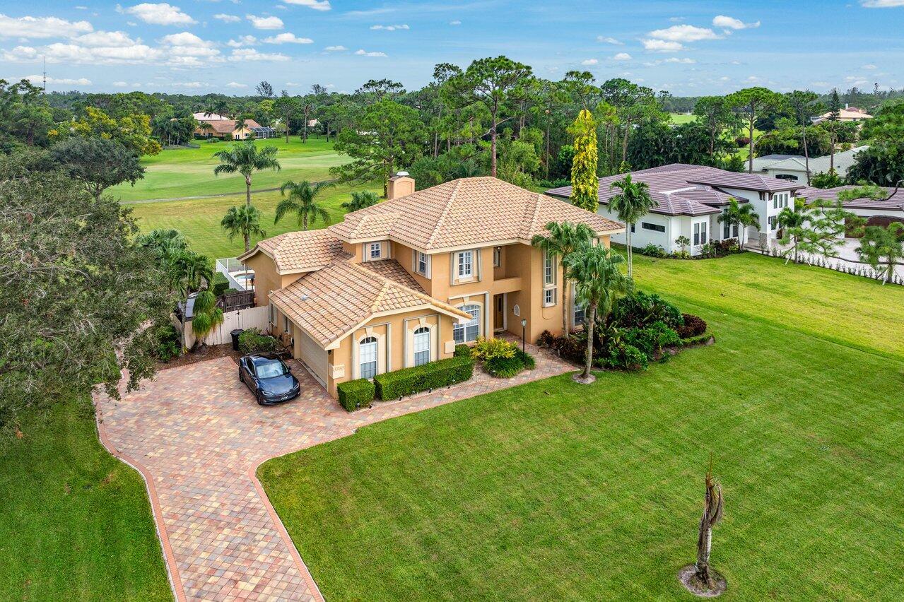 Spacious 5-bedroom, 4-bath, two-story home on a 1-acre lot in sought-after Bay Hill Estates. New porcelain tile floors, 2005 roof, stainless steel appliances, plantation shutters inside, and accordion shutters outside for hurricane protection. The refinished pool has a gas-heated spa, and the covered patio includes a built-in barbecue. The family room has vaulted ceilings and opens to the kitchen, while the living room features volume ceilings. Upgrades include a new drain field (2020), paver driveway, and low HOA fees covering 24-hour security, internet, cable, and common areas. AC units replaced in 2012 and 2017; water heater in 2018.