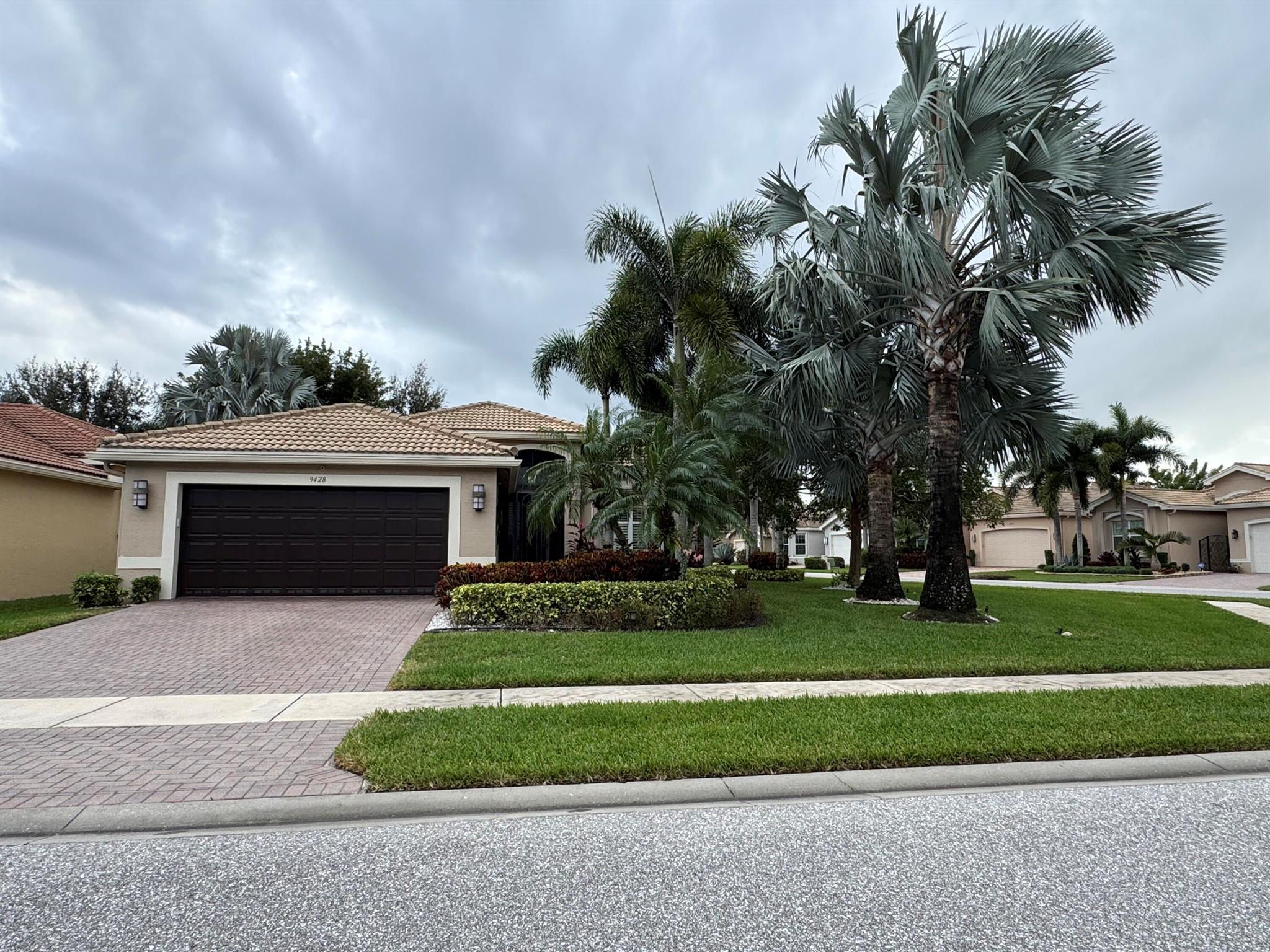 Looking for your Tropical Paridise? You just found it! This very alluring open floor plan home is private, serene, features an extended lanai to relax in while enjoying your lushly landscaped backyard; set on an oversized corner lot. It is walking distance to the clubhouse and various activities. Boasting a gorgeous white kitchen with a counter height quartz snack bar flowing into a matching backsplash. Pull-outs, newer appliances; tile floors in living areas and laminate floors in bedrooms...no carpeting. Plantation Shutters throughout, ceiling fans, crown molding, new washer and dryer, custom fitted closets, updated bath 2, and more!!! Valencia Reserve is an extremely sought after 55+ Community! Welcome Home!!!