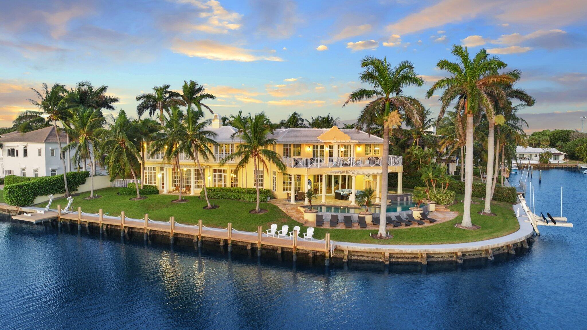 This exceptional Bermuda-style estate in Gulf Stream offers 253 feet of waterfront, capturing stunning views of the Intracoastal and Gulf Stream Golf Club. Designed by renowned architect Shane Ames, the property showcases meticulous craftsmanship with trellis systems, marble patios, and a vanishing-edge pool. The interiors are equally impressive, featuring spacious living areas with high, beamed ceilings, intricate moldings, and an atmosphere of refined luxury, inviting relaxation and decadent entertaining.This rare property combines elegance, comfort, and unparalleled views in a prestigious Gulf Stream location.