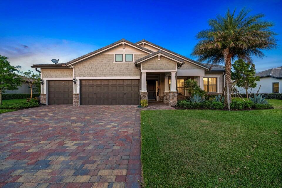 OWNER EXTREMELY MOTIVATED/BELOW MARKET FOR LARGEST MODEL!  Home  shows meticously and on 1/3 acre! Upgrades galore. 4 bedrooms/open Florida living style. 5th rm has murphy bed system. Coffered ceilings. Living and dining rooms feature 'no corner doors' leading out to the spacious screened lanai. Extra footage added to 3 car garage.  Chef's kitchen features, spacious pantry with custom built ins, gas cooktop, huge island with kitchen seating, and high end SS appliances. Expansive primary bedroom features two elaborate walk-in closets.  Split bedroom floorplan allows privacy for all. This home is not to be missed! Two Tesla charging stations. NEWLY FENCED YARD SINCE PHOTOS. Sandhill Crane golf course is adjacent to the home for golf & dining. Great benefit without joining a Club membership!