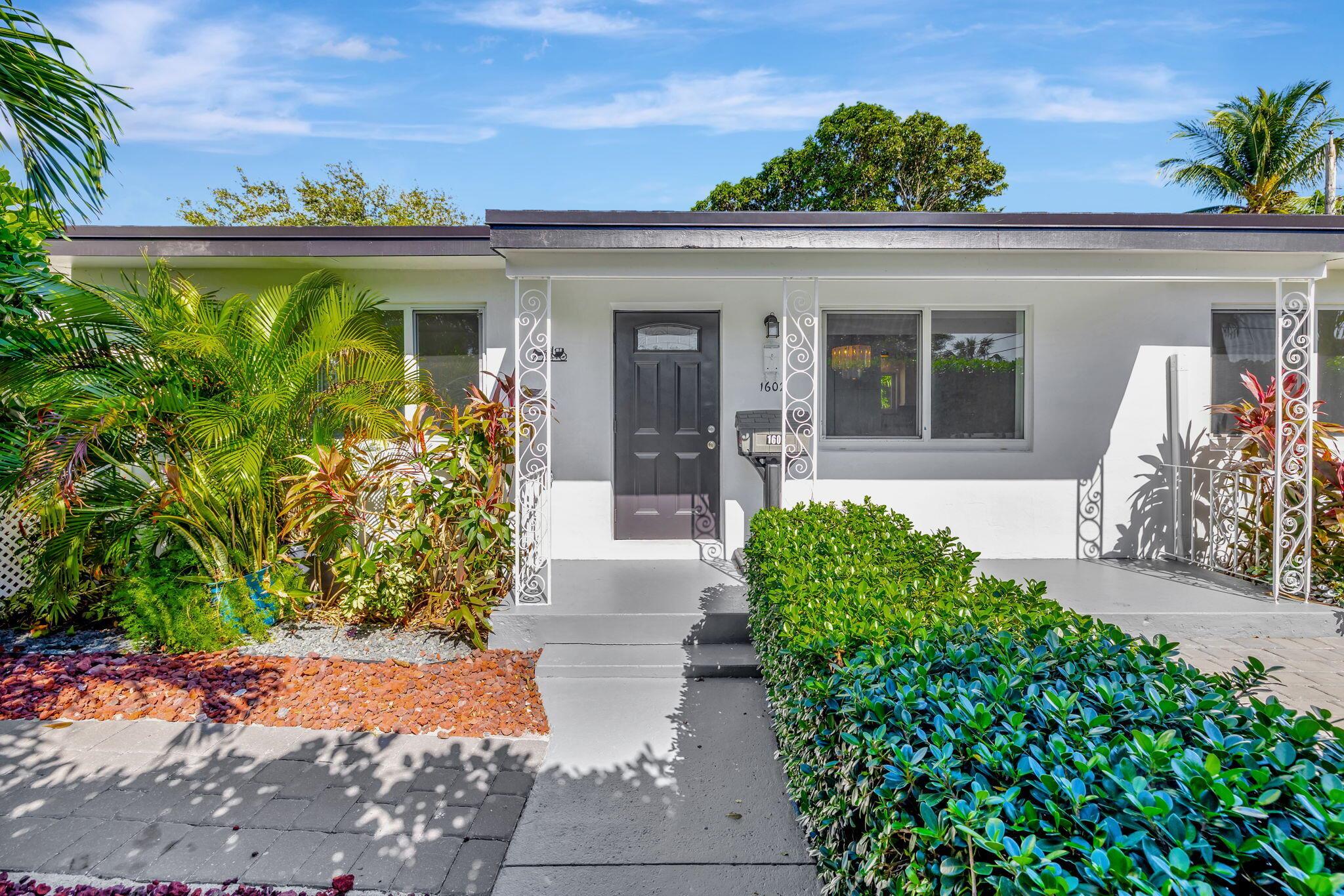 Charming South-Facing Gem with Modern Upgrades in North Lake Worth.  Located in the highly desirable North Lake Worth area near the coast, this beautifully updated 3-bedroom, 2-bathroom home is a true treasure. The south-facing property is bathed in natural light throughout the day, creating a warm and inviting atmosphere inside and out. The home has been meticulously renovated with high-end features, including brand-new impact-resistant windows for peace of mind and energy efficiency. A state-of-the-art HVAC system, complete with a UV sanitizer, ensures year-round comfort and clean air, while central heating provides warmth during cooler months. The roof is a true standout, having been completely reconstructed with new cedar fascia and top-quality shingles, promising durability and style