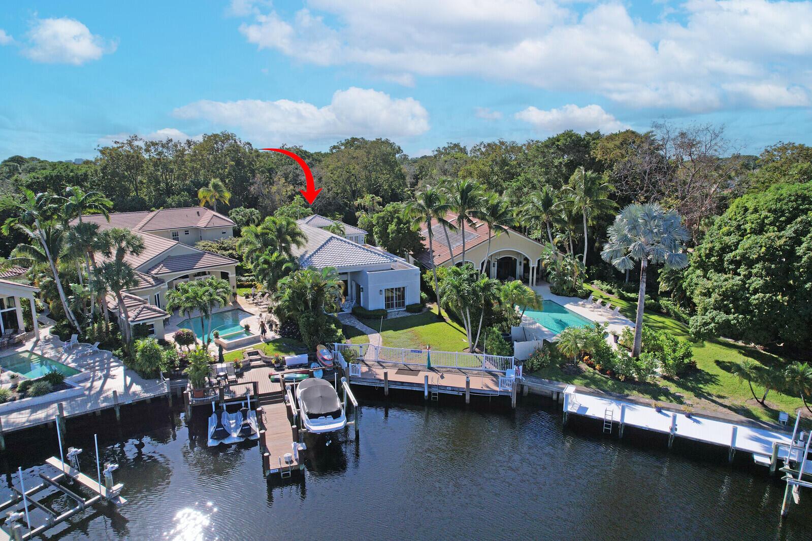 Beautiful setting wtih deep wateraccess to the intercoastal. Upgraded courtyard home with guest home on a quiet street.