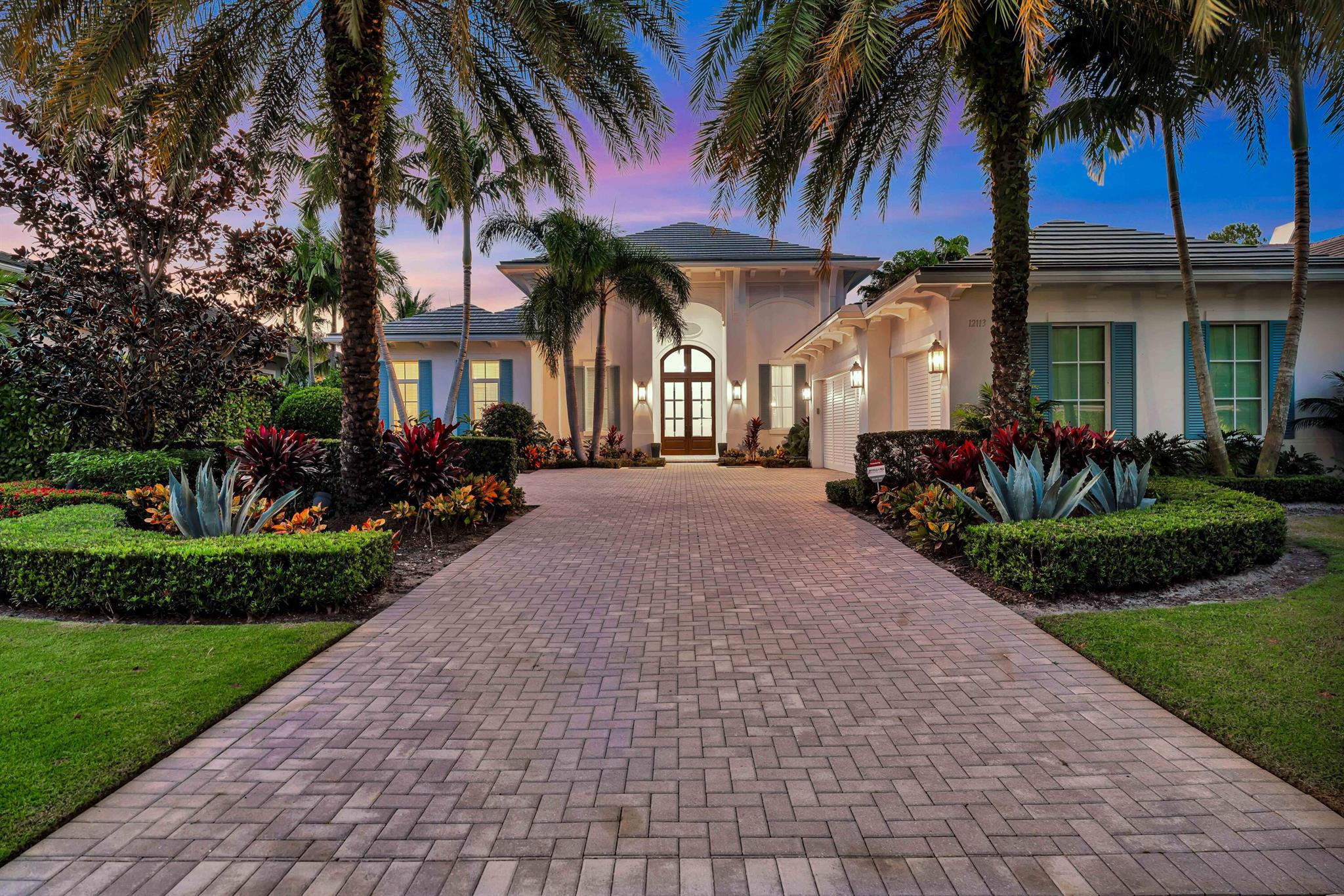 Welcome to this exceptional golf course home on prestigious Plantation Way in the renowned Old Palm Golf Club. This stunning 4-bedroom, 4.2-bathroom residence offers 4,745 square feet of thoughtfully designed living space, perfectly blending luxury, comfort, and functionality.Step inside to discover a bright and airy great room, filled with natural light and ideal for both relaxing and entertaining. The spacious kitchen is a chef's dream, featuring top-of-the-line appliances, custom cabinetry, and ample counter space. Marble flooring flows seamlessly throughout the home, complementing the elegant moldings and sophisticated finishes that elevate every corner of this residence.The expansive loggia with electronic screens is a highlight, providing a serene outdoor retreat for dining, entertaining, or simply enjoying the beautiful golf course views. With its seamless indoor-outdoor flow, this home is tailor-made for Florida living at its finest.

Situated in the exclusive Old Palm Golf Club, this property offers access to world-class amenities. Residents enjoy a newly renovated clubhouse, a state-of-the-art 20,000-square-foot lifestyle center, and a 33-acre practice facility, designed to cater to every aspect of the luxury lifestyle. From exceptional golf to a vibrant community atmosphere, Old Palm sets the standard for premier living.

This remarkable home combines timeless elegance with modern convenience in one of the most sought-after neighborhoods. Don't miss your opportunity to experience the ultimate in golf course living.