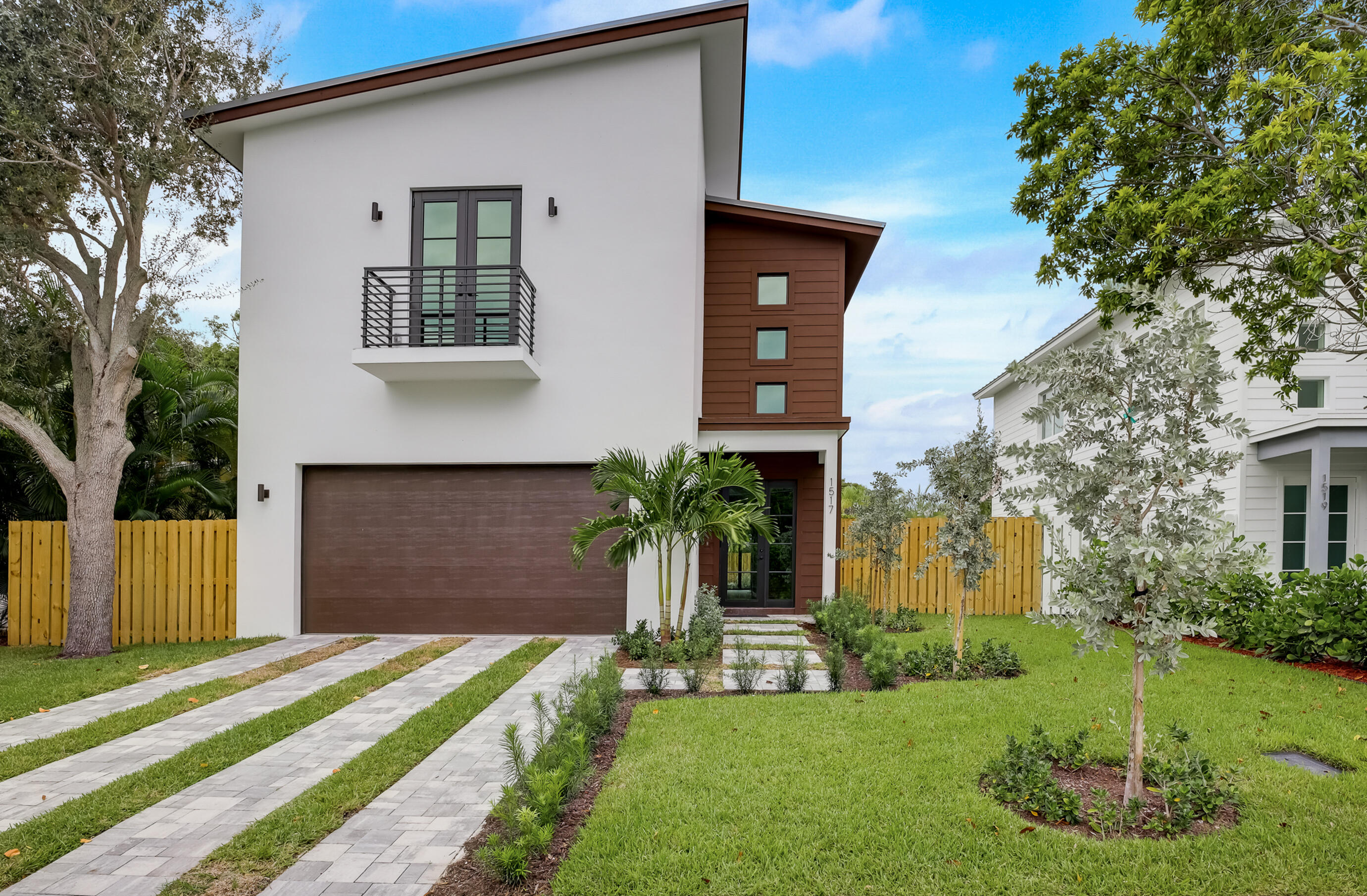 Stunning, newly built (2022) two-story home is designed for both entertaining and everyday living. Located on a quiet street of North Lakeside near the Intracoastal and Lake Worth Golf Course, this property offers convenient access to Palm Beach, PBIA, downtown West Palm Beach, and Lake Worth Beach.This home is truly a private oasis with luxury finishes throughout, perfect for buyers seeking modern elegance and convenience. Features include CBS home with hurricane impact rated windows and doors, standing seam metal roof, Bosch Appliances, MOEN plumbing fixtures, Energy efficient HVAC units and Icynene insulation. 10' ceilings, 8' doors, modern LED wrapped living room soffit, wide plank engineered wood flooring, bar featuring wine cooler and beverage cooer, sleek rectangular pool with sun shelf, decorative pavers, fully irrigated tropical landscaping and privacy fence.