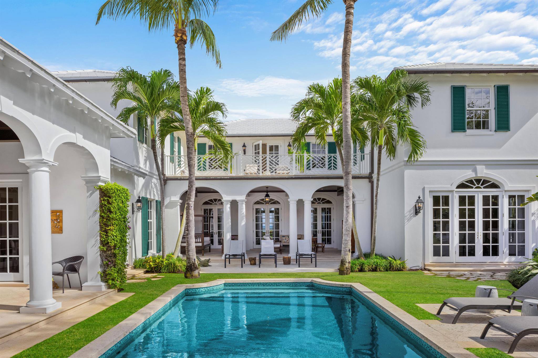 Welcome to this move-in ready estate that sits directly on the beaches of exclusive Jupiter Island. A true turnkey luxury retreat that offers immediate peace of mind. This beautiful 5 bed, 7.5 bath home enjoys a 16' elevation, is located on 1.52 acres with 136 feet of private beachfront. The newer (2007) home is 7,597 square feet and perfectly situated for those seeking the idyllic lifestyle.  Designed by renowned architect, Thomas Kirchhoff the home has a private island, richly appointed aesthetic, with high ceilings and Brazilian walnut floors throughout.  The first floor has floor to ceiling French doors with an expansive living room having breathtaking ocean views, a custom office with beautiful cypress walls and built-ins, two dining rooms a guest bedroom and private bath. A separate family/great room is perfect for those indoor gatherings, overlooking the picturesque pool and private gardens.  The ultimate chef's kitchen features a Wolf oven, twin Subzeros, two dishwashers, an oversized island and butler pantry, ideal for entertaining.  Additional full and half baths, full laundry room, study nook, hidden wet bar and elevator completes the thoughtfully designed first floor. 
 
Take the private elevator or your choice of two winding staircases to the second floor where you will find the masterfully planned layout with four additional bedrooms, five bathrooms and three large terraces with choice of pool/garden or magnificent ocean views.  The large, private primary suite has vaulted ceilings, his and her custom closets and his and her luxury baths.  There are French doors leading to an oversized balcony with Chippendale railing to enjoy unobstructed ocean views or to simply feel those evening ocean breezes.  There are three additional bedrooms on the second floor, two of which have a shared, expansive terrace.  All bedrooms have their own private bathroom and customized closets, perfect for guests or family lifestyle.  Additional laundry and storage for ideal convenience, complete the second floor.  The home has been meticulously maintained, with a brand new clay tile roof (October 2024) and house generator (November 2024) and includes an oversized 3-car attached garage.
 
The unparalleled outdoor beauty of this home, from the private gated courtyard with gardens and custom swimming pool with waterfall feature, to the multiple covered loggias and outdoor kitchen create the ease in al fresco dining. Once you take the private pathway among the seagrape foliage to your secluded beach, you begin to understand the mantra of "today matters".