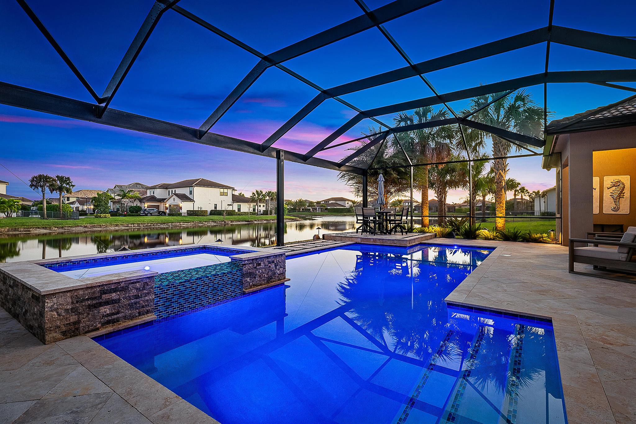 Presenting a stunning five-bedroom plus den smart home nestled on one of the most coveted lots in Sonoma Isles, Jupiter. Surrounded by serene water views & natural preserves, this expansive Clubview model stands as the largest one-level floor plan in the community, meticulously designed & filled with luxurious upgrades. The custom saltwater pool, framed by elegant travertine decking, offers a private oasis, complemented by a fully equipped outdoor kitchen--perfect for alfresco dining & entertaining. Inside, the chef's kitchen dazzles with premium KitchenAid appliances, double ovens, custom cabinetry, & a marble backsplash--a dream for any culinary enthusiast. Seamlessly blending indoor & outdoor living, the home features a zero-corner sliding door that opens to an entertainer's paradise. Enjoy music throughout with the integrated Sonos audio system, providing premium sound in the kitchen, master suite, lanai, &amp; pool area. Additional luxury features include a tankless water heater, impact glass, crown molding throughout, &amp; an oversized three-car garage with custom epoxy flooring &amp; cabinetry. Thoughtful landscaping &amp; exterior lighting elevate the home's curb appeal, while a comprehensive security system provides peace of mind. Sonoma Isles offers an unparalleled lifestyle with 24/7 security &amp; a host of amenities, including a clubhouse with meeting spaces, fire pit, tennis &amp; pickleball courts, playground, &amp; more. Perfectly situated in the heart of Jupiter, this property is zoned for top-rated schools, making it an exceptional choice for luxury living in South Florida.
