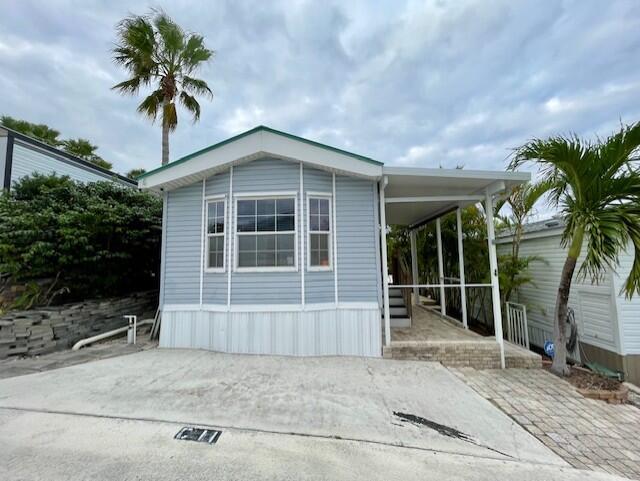 Great opportunity to own your own lot & park model in Juno Ocean Walk! Located just a short distance from the Atlantic Ocean this community offers a club house with heated pool, spa, billiards room, playground, pickleball court, Petanque and Volleyball courts. This lot is being sold with a 2006, 35.5' Chariot Park Model with full size bathroom, granite kitchen counters and inside laundry. There is no waiting time to rent, which makes for great rental income potential!