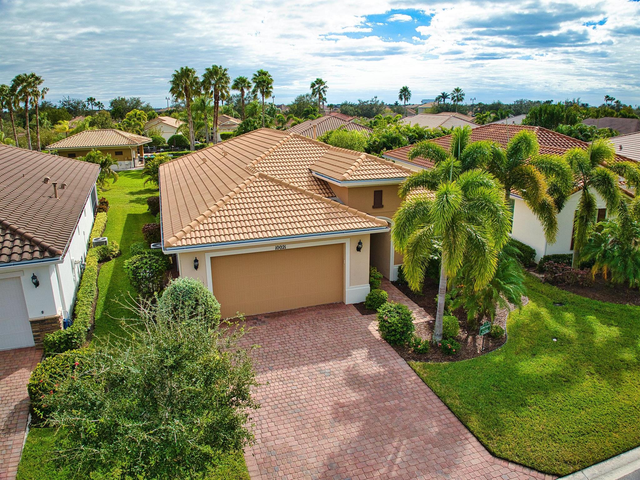 This extremely rare ''Ponte Vedra'' model and meticulously maintained home offers over 2100 square feet of elegant living space, making it a standout within the community. Boasting 3 bedrooms, 2 baths, and a versatile den, this residence is designed for both comfort and style. From the moment you enter, the attention to detail is evident--impact windows & doors, plantation shutters, tile roof, pristine tile, and luxury vinyl plank flooring throughout ensure a luxurious lifestyle with no carpet in sight. The kitchen is a chef's dream, featuring a gas cooktop, dual wall ovens, granite countertops, and a spacious butler's pantry, perfect for meal prep.  This beauty also features a full house generator, an extended garage and lanai and freshly painted exterior. See it now before it's gone! The home's layout offers privacy and flexibility, with two generously sized guest bedrooms tucked away from the main living areas, ensuring a quiet retreat for visitors. The large den is a versatile space, ideal for a home office, media room, or even a hobby area. The oversized master suite serves as a private sanctuary, complete with a massive walk-in closet, dual vanities, and a spa-like stand-up shower designed for relaxation. Outdoor living is equally impressive, with an extended, covered, and screened lanai overlooking lush, private landscaping&#x14;perfect for sipping morning coffee or hosting outdoor gatherings. The home's premium location is just a short walk to the community's second pool, complete with a cabana, offering a resort-like experience as if you had your very own private pool. This unique and rare model-like home is a true gem, combining luxury, functionality, and an unbeatable location, making it a must-see for discerning buyers.