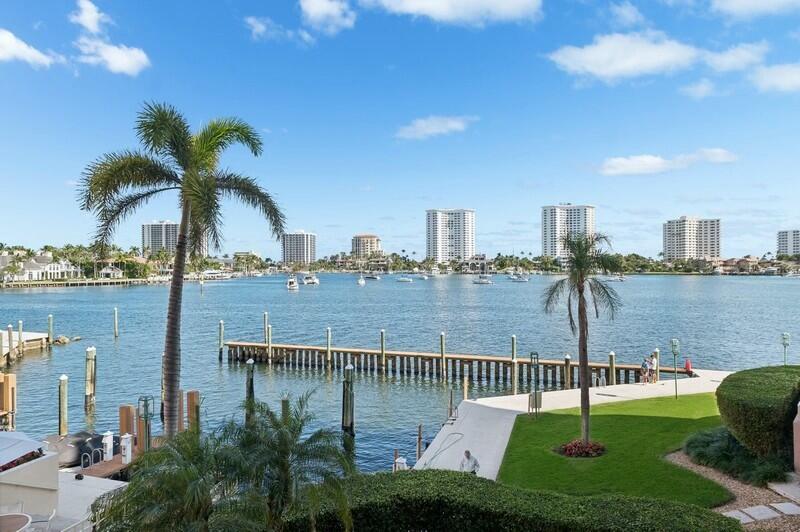 Highly coveted waterfront condo directly on Lake Boca Raton, with unique open railing on 2nd floor affording panoramic views of the pools, boat slips, and Intracoastal waterway.  Easy access to elevator, garage parking, and lobbies.  Nine foot ceilings throughout, and open floor plan with flexible living/dining areas.  Wonderful open kitchen for entertaining, loads of walk-in closets, wet bar, and huge balcony accessible from every room.Mizner Tower has top-of-the-line services, including concierge, valet, pool attendant, 24 hour security, and on site management.  Updated amenities by Steven G Interiors, including member's lounge, card room, 2 gyms, 2 tennis courts, large outdoor summer kitchens and patios, steam and sauna, and much more for those who love luxury and pampering!