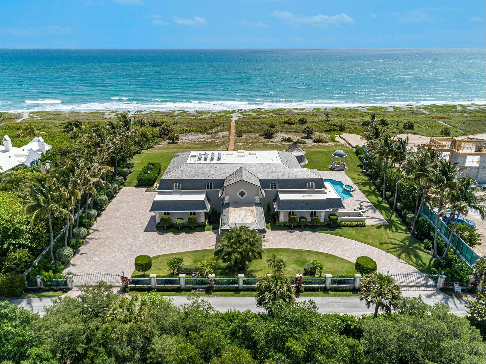 Gorgeous direct oceanfront estate located on the southern end of Jupiter Island. This private property sits on 2.62 acres and has 222' of captivating oceanfront views. This home is perfect for entertaining whether you are inside or out on the expansive open patio!