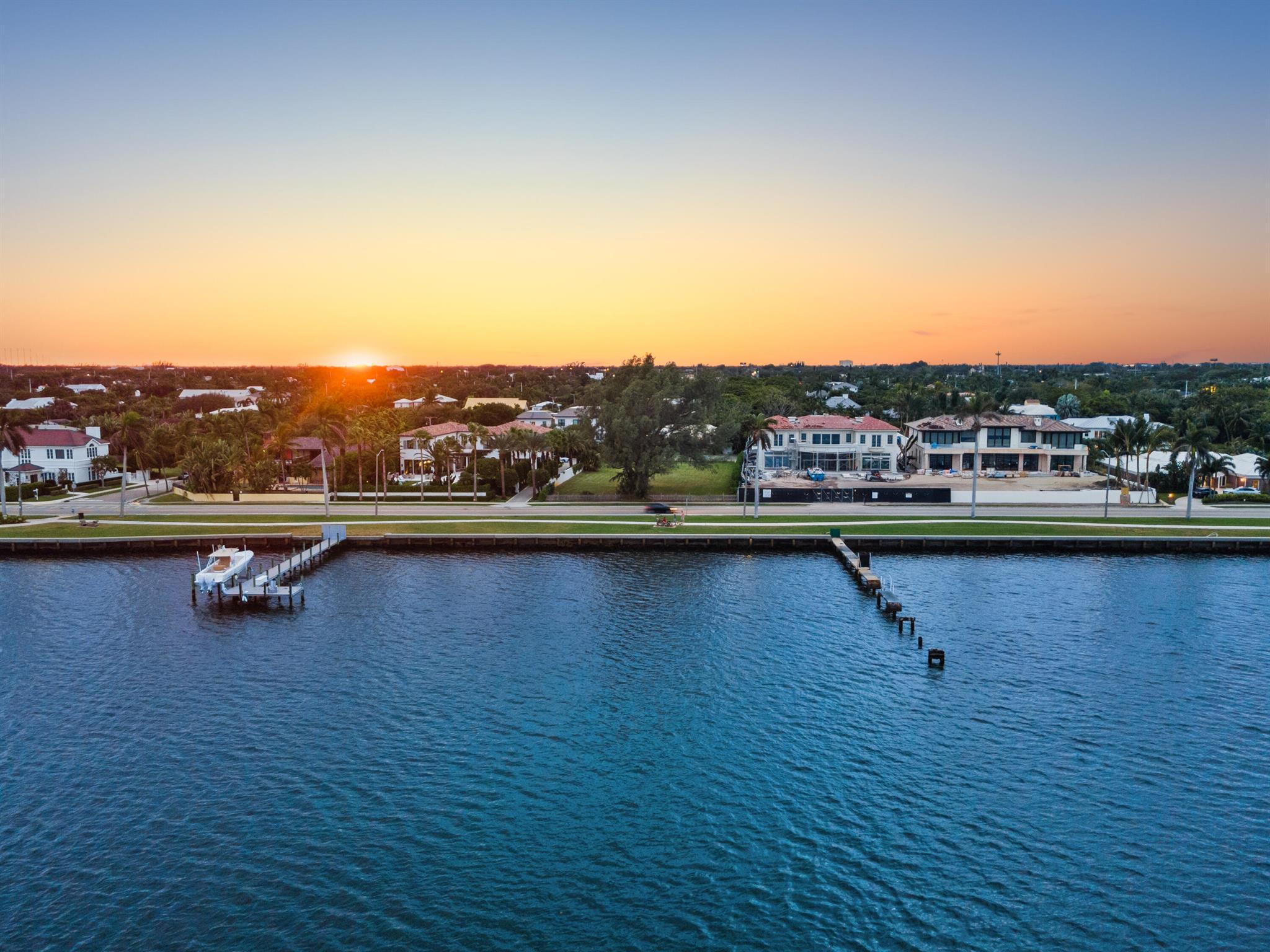 Prime buildable waterfront lot opportunity in the sought-after South of Southern neighborhood of West Palm Beach, Florida. This massive 1.2 + /- acre property offers unobstructed, wide water views of the Intracoastal Waterway directly across South Flagler Drive, complete with riparian rights.Available for the first time in decades, this property presents a rare chance for developers or discerning buyers to build a bespoke estate on South Flagler Drive, within an iconic waterfront compound. The existing 3,577 SqFt home features 3 bedrooms + a den, 3 bathrooms, a pool, and an outdoor loggia--perfect for Florida living while planning future development. Perfectly located near Palm Beach Island, PBI Airport, premier shopping, dining, & more. The information published and provided including but not limited to prices, measurements, square footages, lot sizes, features, finishes, and calculations are subject to errors, omissions or changes without notice. All such information should be independently verified. All parties should perform their own due diligence to verify all information.