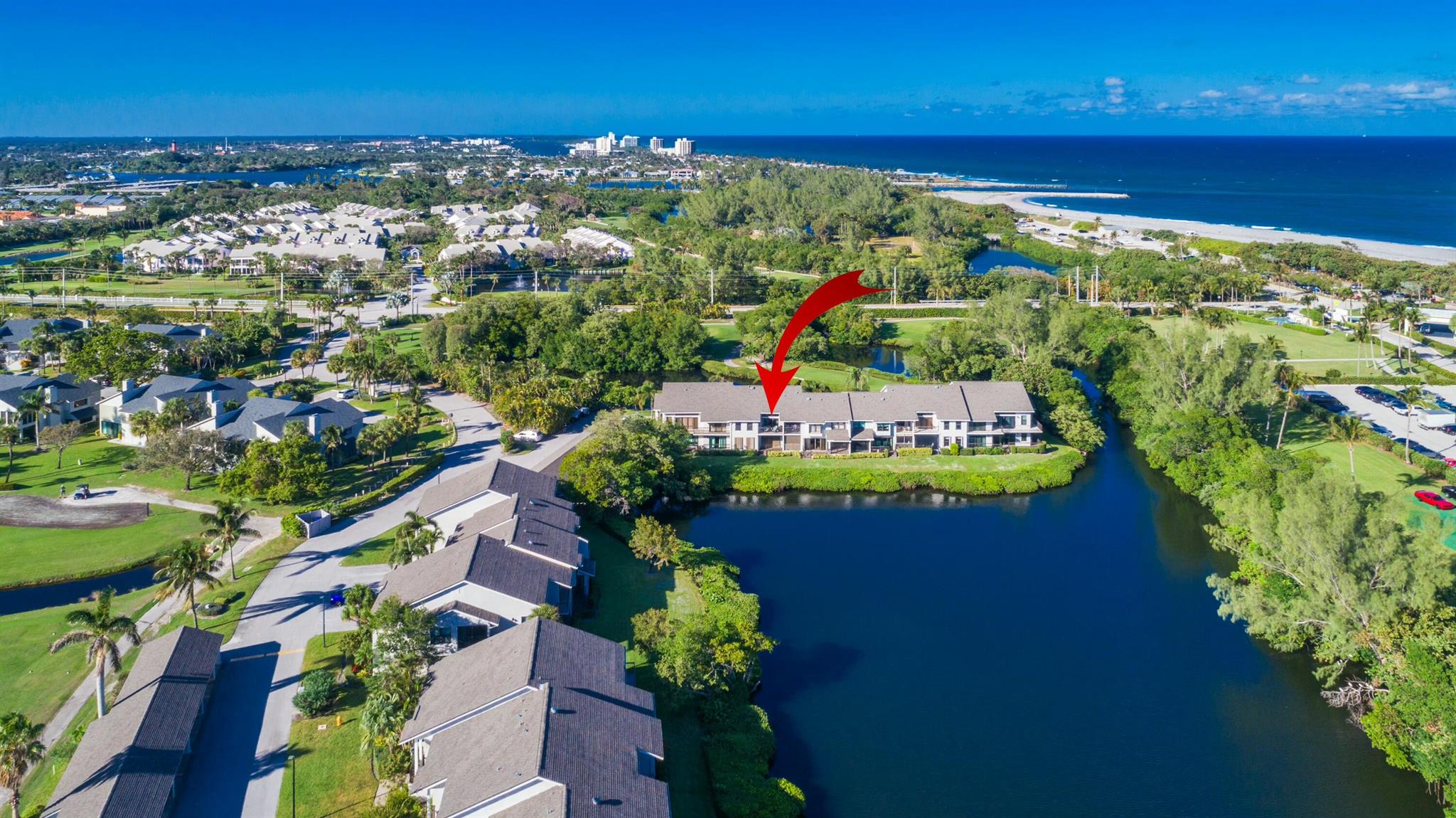 OVERSIZED WATERFRONT CONDO IN JUPITER DUNES, A BEACHSIDE GOLF COMMUNITY!Imagine waking up to stunning southern exposure LAGOON views from all the main living areas of your home.  This meticulously maintained 1380sqft, 2 BED, 2 BATH home offers an UPGRADED kitchen with granite, high end cabinetry and stainless appliances. The home stands out with modern touches and high-quality finishes. The oversized, neutral tiles throughout create a seamless and elegant look.Located just STEPS TO the BEACH AND it's DOG friendly! Entertainment, shops, restaurants, boating, paddle boarding, parks, Maltz theater are walking distance or GOLF CART TAXI ride away! Nearby parks offer PICKELBALL, trails and amphitheater! There's more, GOLF WITH NO MEMBERSHIP REQUIREMENTS. JUPITER DUNES IS A LIFESTYLE!