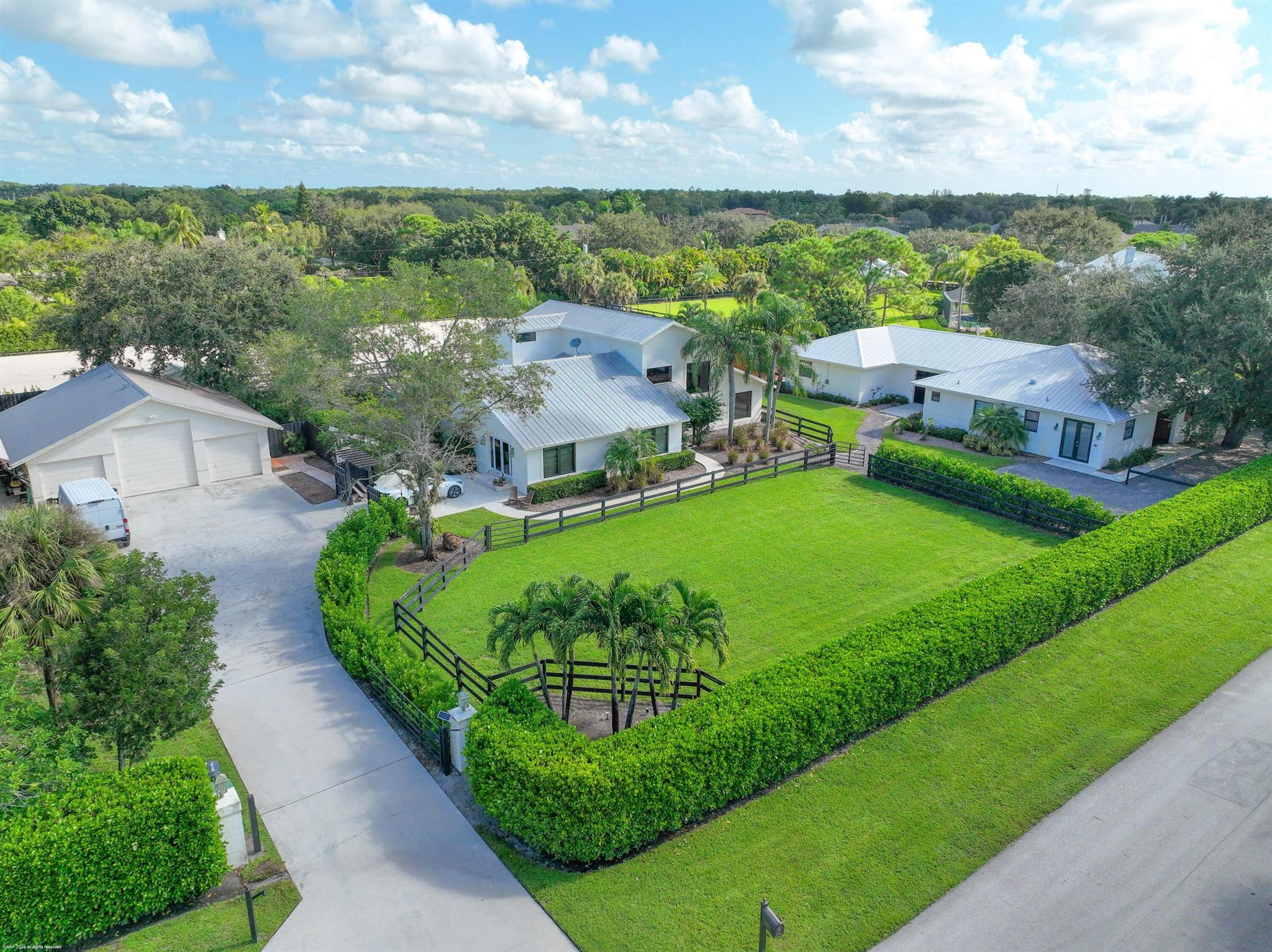 Inviting equestrian property with everything you need to to enjoy the Wellington equestrian lifestyle! Located in the esteemed neighborhood of Paddock Park 2 on just under 2 acres, this farm boasts a beautiful 4 bedroom, 2.5 bathroom pool home, a new 7 stall barn w/ great grooms accommodations, additional 3-stall shed row barn, a large arena and paddocks.  Located close by Wellington's well maintained bridle trail system and with a short golf cart ride to the horse show, this is a great offering as a seasonal home!  Price reflects entire property for a 4 month season. House driveway or garage/workshop will not be a part of the lease. Tenant to setup fly spray and manure removal. Electricity & wifi to be taken out of utility deposit. Tractor, drag and jumps provided by LL. The two-story home features a beautiful open concept floor plan, vaulted ceilings and tons of natural light. The first floor includes 3 guest bedrooms, one full bath and one half bath, family room and a formal dining area. The charming kitchen offers granite countertops, stainless appliances, ample storage, an eat-in breakfast area as well as a custom wine bar with a wine cooler. Upstairs you will find a luxurious master suite with a balcony offering great views of both the pool and riding arena. A spiral staircase leads down to the enclosed patio that boasts a built-in grill, stunning travertine tile surrounding the free-form, heated saltwater pool and spa. 

The 7-stall, CBS constructed, commercially built barn (completed in 2016 with fire alarm &amp; sprinkler system) features a full bath, tack room with laundry, feed room and a 611 sqft large 1 bedroom, 1 bath apartment with a full kitchen. Immediately adjacent to the barn is the gorgeous new shed row barn with 3 additional stalls with electric and water to each stall. There is rubber matting throughout, a fly spray system, security cameras, fire alarm and sprinklers. The 216'x112' all-weather riding arena has full drainage in place with GGT footing. There are 2 separate driveways for the barn and house for ultimate privacy. Notable extras include a 500 gallon in-ground propane tank, reverse osmosis water filtration for house and barn, impact glass and doors through out, security alarm + cameras and salt water pool with spa.