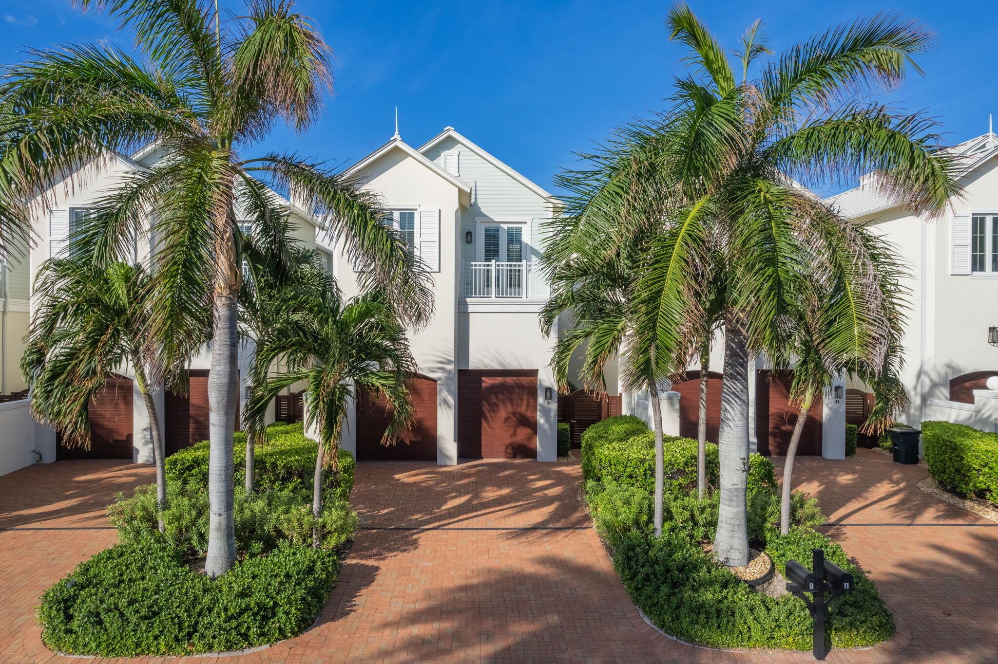 Nestled in a prime location with exclusive deeded beach access, this exquisite townhome offers the perfect blend of luxury, comfort, and coastal charm. Flooded with natural light, the open-concept design showcases soaring high ceilings and an impeccable layout, ensuring a seamless flow between spaces. Every corner is thoughtfully curated with premium finishes, from the custom millwork to the elegant built-in closets. The chef's kitchen features top-of-the-line appliances, sleek  countertops, and open layout. Whether you're enjoying the spacious living area or relaxing in the lush private outdoor entryway, the home's thoughtful design exudes a sense of tranquility and sophistication. This is truly a one-of-a-kind home, where attention to detail meets coastal luxury.