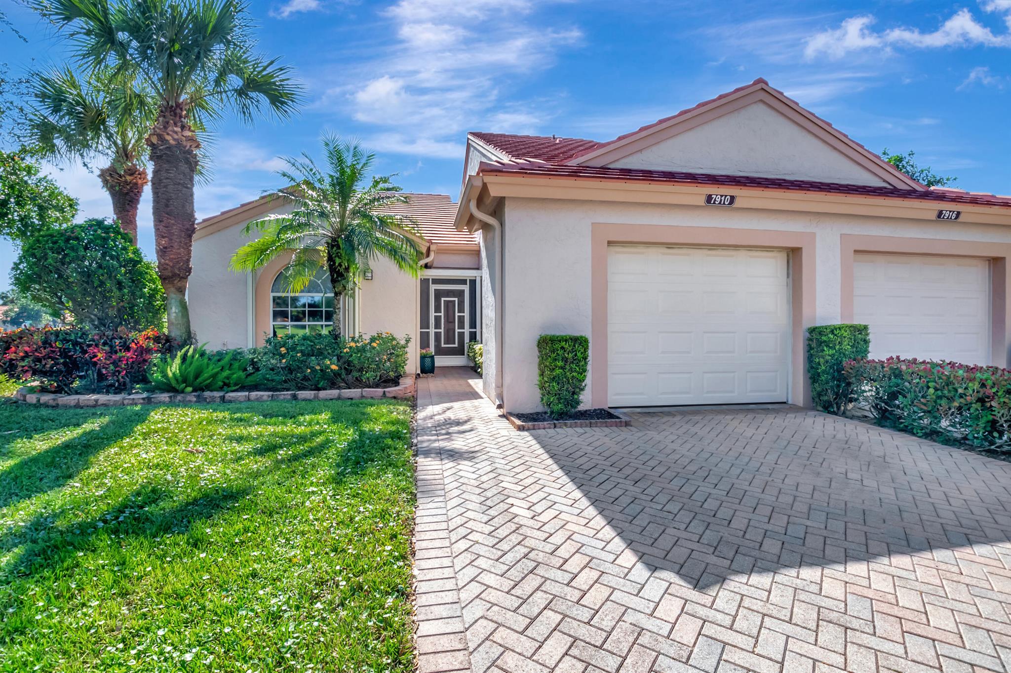 Welcome to this meticulously upgraded corner villa located in the highly sought-after active community of Emerald Pointe in Delray Beach. Offering serene lake views, this spacious 2 bedroom, 2 bathroom home plus a den exudes comfort and charm. As you enter, you'll be greeted by an open-concept floor plan with soaring vaulted ceilings, creating a bright and airy atmosphere that seamlessly connects the living, dining and kitchen areas. The kitchen is a chef's dream, featuring upgraded granite countertops, a custom tile backsplash and newer appliances. The primary bathroom was thoughtfully renovated in 2023, showcasing luxurious finishes that provide a spa like experience. The villa also has a 1 car garage with a double driveway providing ample parking, new impact garage door in 2020. Recent updates include new AC and WH in 2023. The exterior of the home is scheduled to be painted before the end of the year. Emerald Pointe offers an impressive array of amenities, including a fitness center, pool, sauna, pickleball and tennis. Located just minutes from Downtown Delray Beach, where you will have easy access to top-tier dining, shopping an entertainment options.  WELCOME HOME!