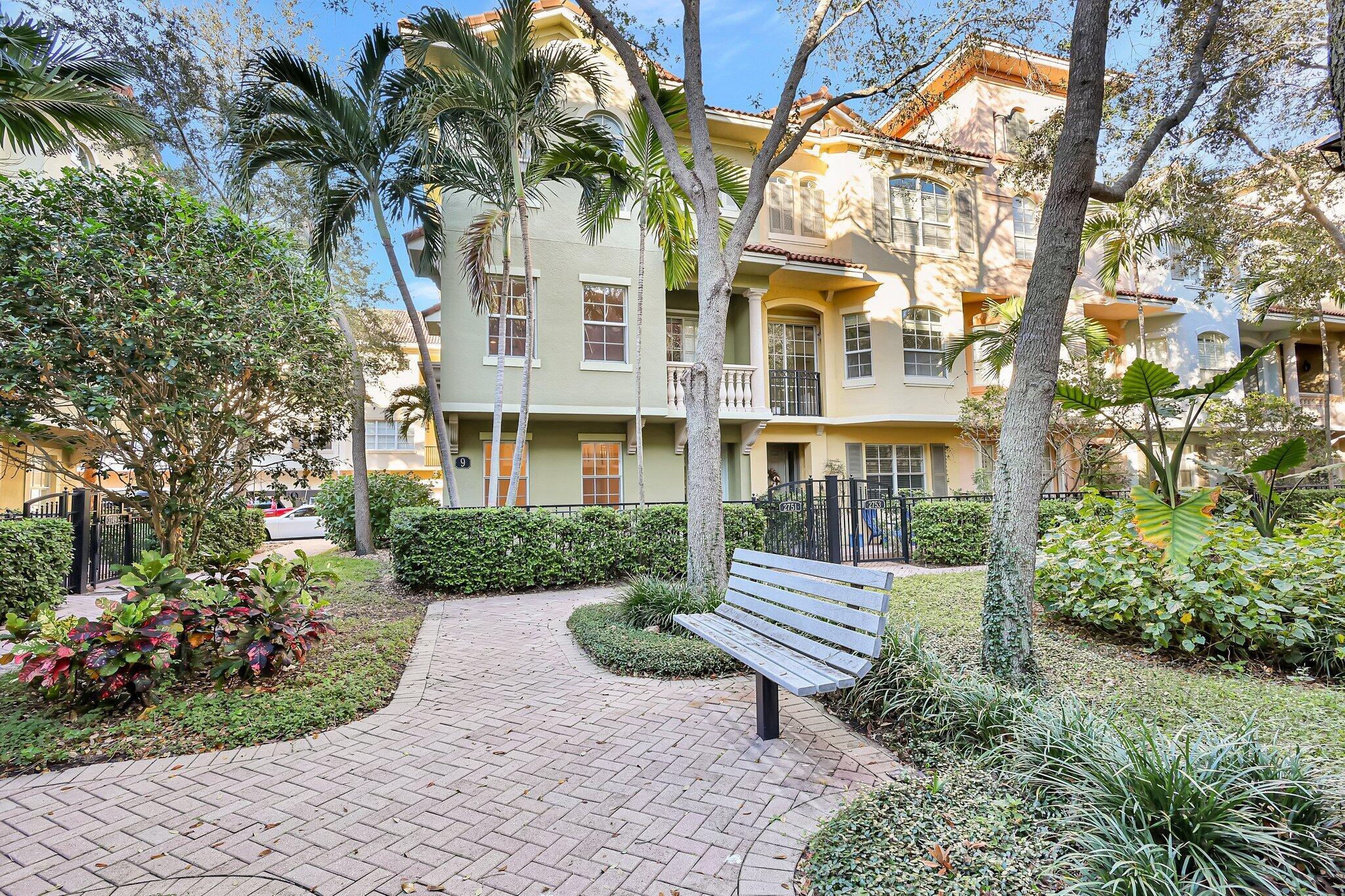 Exceptional Corner Townhome in a Courtyard Park Setting. Spacious 3-bedroom, 3.5-bath, 2-car garage corner unit, one of the largest in the community. Stroll through lush gardens to your private gated patio entrance. Extra windows for abundant natural light. Versatile den/flex space w full bath on the 1st floor. Wood kitchen cabinetry, granite countertops, extended bar, additional serving bar & large pantry. The large master suite offers park views & huge walk-in closet. Oversized dual-sink vanity, Roman tub & walkin shower. Enjoy outdoor living w multiple balconies & fenced patio. Volume ceilings create a larger sense of space & amenities including clubhouse, pool, jacuzzi, gym, picnic area & boardwalk. Downtown location close PGA national, walk to Palm Beach Gardens mall & restaurants