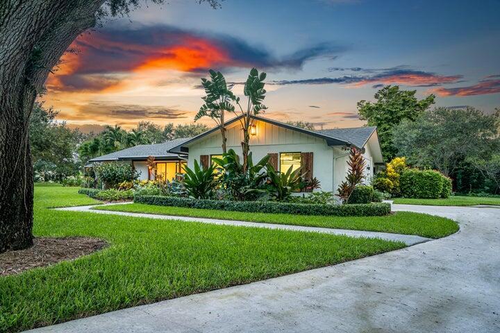 Welcome to your private 1.42 acre paradise in the middle of Palm Beach Gardens. This newly renovated, contemporary ranch style ''smart'' pool home has tranquil, California vibes nestled on an expansive 1.42 acre lot. in a private cul-de-sac. Enjoy your designer styled home, complete with luxury features throughout. Experience true Florida living with tons of natural light. Spacious living and dining areas with stunning custom lighting fixtures overlook a beautiful bright kitchen, complete with modern Italian cabinetry and Schwinn hardware. Gorgeous calacatta quartz countertops with a custom waterfall edge and a bar pass through for entertaining. All Bosch appliances, including built in coffee bar. Huge 12 x 24 Italian porcelain tiles throughout elevate the contemporary style. The huge, private primary bedroom wing includes a lovely sitting area plus dual expansive walk in closets with custom closet systems. Relax in the spa like primary suite bath-complete with double sinks overlooking the lush landscape. Grab your favorite book and enjoy the luxurious free standing soaking tub plus expansive shower in a beautifully designed wet room. Off the primary suite is a complete bedroom/den/office plus full bath. The split bedroom plan is perfect for privacy, with two bedrooms plus full cabana bath on the other side of the home. Smart, energy efficient home features include Nest thermometers for both a/c units, Ring doorbell and cameras, built in wifi booster plus reverse osmosis water system for the kitchen and laundry. Current owners recently added new Icynene insulation throughout ($12k upgrade) for maximum cooling and heating efficiency. Venture outside and enjoy an incredible back yard oasis, complete with salt water pool and tropical tiki hut. Also includes newly sealed 2 car garage plus custom covered gutters on the home exterior for maintenance ease. The house has complete hurricane impact windows throughout for your protection and CBS construction. There is PLENTY of room to expand or build on the home, add pickleball courts or a guest house. The owner already has architectural plans for a possible future expansion if you wish. The large, beautifully landscaped lot can accommodate whatever your heart desires. This meticulously kept home truly has it all- turn key perfection! This stunning home is located in equestrian friendly Horseshoe Acres, right in the heart of Palm Beach Gardens. Horseshoe Acres enjoys LOW HOA fees and a gated entry. Location is everything!! It's one of the only neighborhoods left in the bustling area with large lots, conveniently located within a few minutes to all major highways, beaches and shopping. You'll truly feel like you're in your own, private paradise. Furniture negotiable. Currently tenant occupied until 3/19/25. Great investment opportunity!