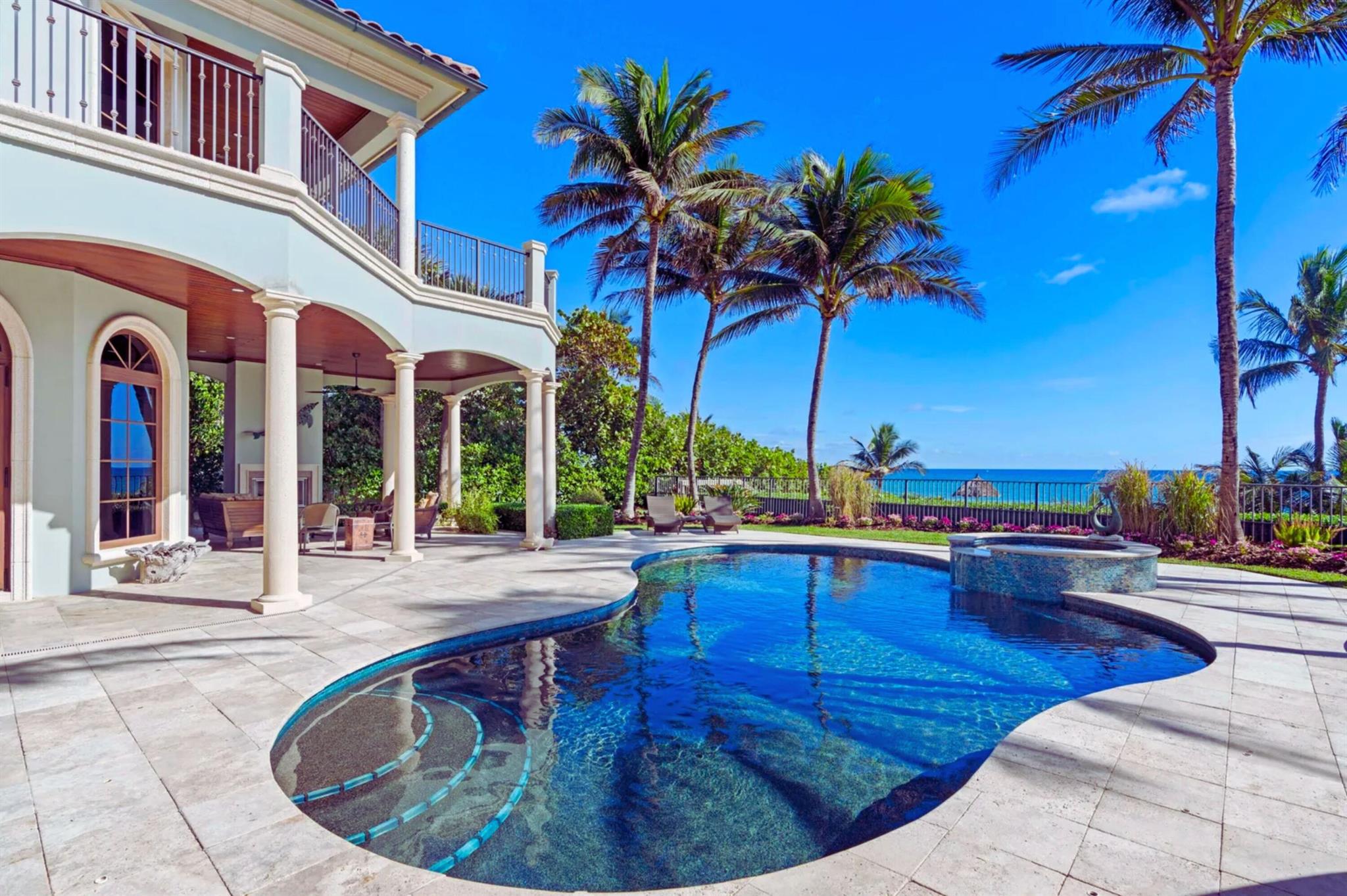 The height of luxury awaits at this premier oceanfront residence, a serene haven in the exclusive enclave of Byrd Beach. Close to vibrant Delray Beach and Boca Raton yet worlds apart, You will immediately be struck by the peace and privacy surrounding this Mediterranean-inspired estate. Nearly 9,400 square feet in total, including shady terraces and a sparkling waterside pool, the home's timeless design, fine craftsmanship, and lavish finishes impress at every turn. Inside, soaring ceilings and vast windows offer mesmerizing views from nearly every room. Exquisite entertaining spaces, a chef's kitchen, a family room, and a sumptuous primary suite, one of 4 ensuite bedrooms, further elevate the home while an underground garage and elevator add to the WOW factor of this gorgeous retreat.