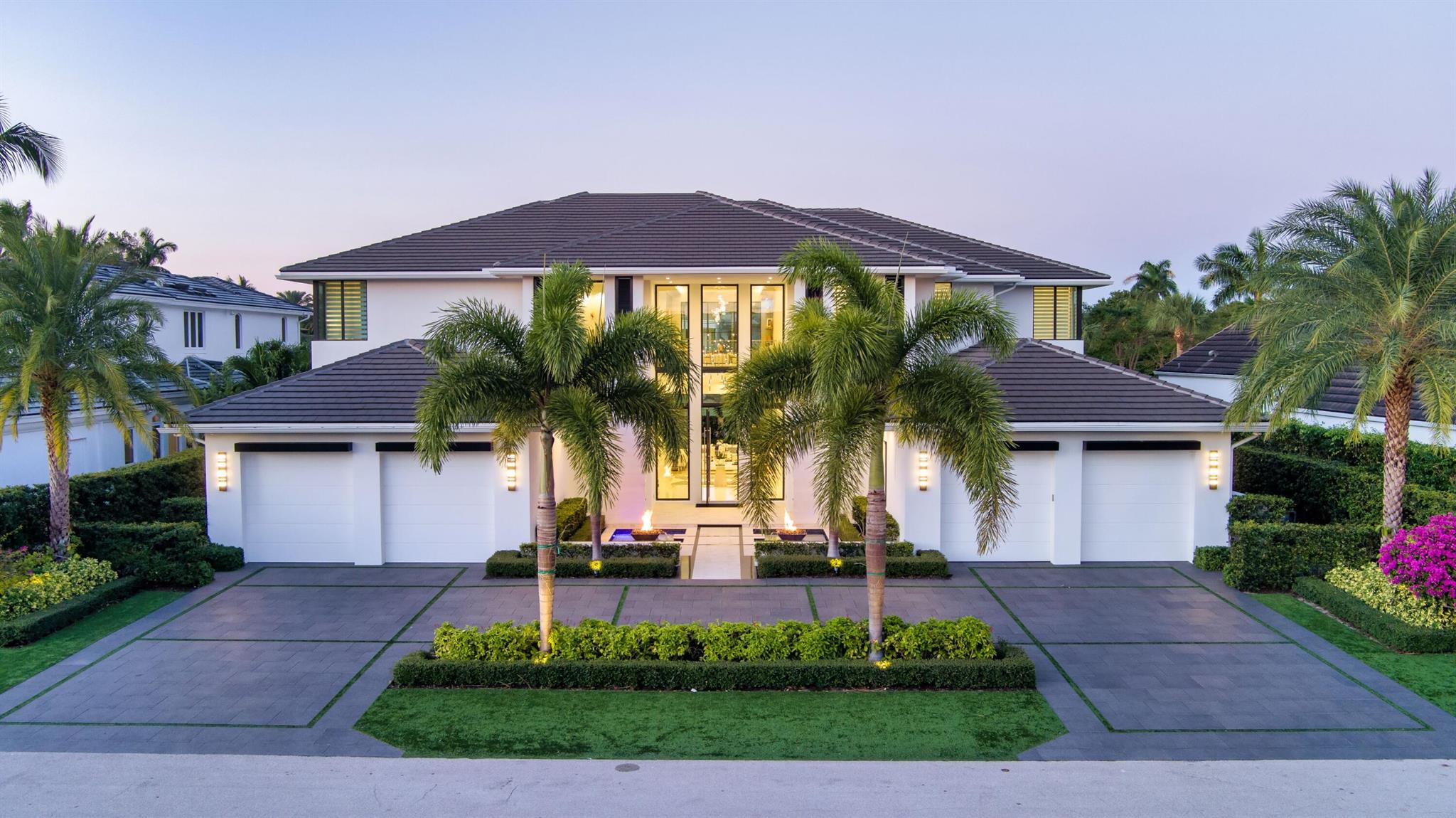 A masterwork of bespoke design, this incredible six-bedroom, 12,228  +/-total-square-foot estate, astutely conceived by Mitch Kunik of Affiniti Architects built in 2021, encapsulates the pinnacle for luxurious living. The spectacular two-story reception hall, with a glass-fronted facade and dramatic floating stairway, welcomes guests into a world of refined elegance. Just beyond the formal dining room, the elegant living room features a 14-foot-high wall of automated sliding glass doors that entirely pocket away, creating a seamless transition to the pool loggia, for an unparalleled indoor-outdoor tropical experience. DISCLAIMER: Information published or otherwise provided by the listing company and its representatives including but not limited to prices, measurements, square footages, lot sizes, calculations, statistics, and videos are deemed reliable but are not guaranteed and are subject to errors, omissions or changes without notice. All such information should be independently verified by any prospective purchaser or seller. Parties should perform their own due diligence to verify such information prior to a sale or listing. Listing company expressly disclaims any warranty or representation regarding such information. Prices published are either list price, sold price, and/or last asking price. The listing company participates in the Multiple Listing Service and IDX. The properties published as listed and sold are not necessarily exclusive to listing company and may be listed or have sold with other members of the Multiple Listing Service. Transactions where listing company represented both buyers and sellers are calculated as two sales. Some affiliations may not be applicable to certain geographic areas. If your property is currently listed with another broker, please disregard any solicitation for services. Information published or otherwise provided by seller, listing company or its representatives is deemed reliable but are not guaranteed and subject to errors, omissions, or changes without notice. Copyright 2024 by the listing company. All Rights Reserved.