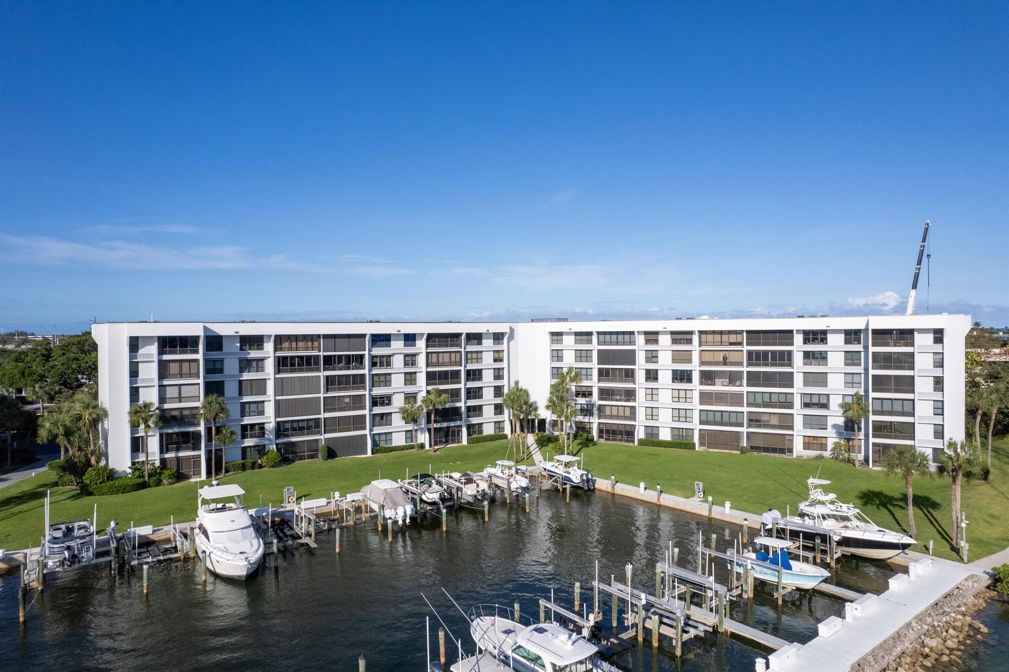 Stunning water views from this top floor impeccably renovated 2/2 condominium in the highly desirable direct Intracoastal gated community of Jupiter Cove.  This condominium is being sold furnished, turnkey and INCLUDES a highly sought after boat slip with 13,000 pound lift. Amenities abound with Pelican Park Tiki Bar and grills, and tables, kayak and paddleboard stands,tennis/pickleball courts,clubhouse and fitness room, party room, heated pool, and Marina. Jupiter Cove is convenient to shopping,restaurants , beaches and PBIA.