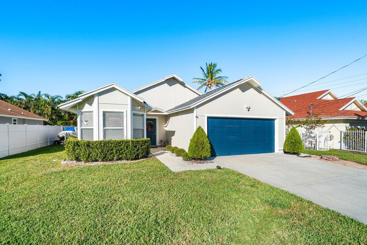 Don't miss the opportunity to own this beautifully renovated home in one of Jupiter's most sought after neighborhoods--with NO HOA! This spacious 3 BR, 2 BA home, plus a den, offers single-story living at its finest. The oversized, modern open kitchen boasts new white cabinets, SS appliances, and sleek quartz countertops, perfect for both everyday living and entertaining. The high-end flooring throughout adds warmth and style.The custom master bathroom is nothing short of breathtaking, featuring a massive dark marble shower with luxurious gold finishes. The 2nd bathroom has also been updated with a contemporary style. NEWER ROOF (2020)The location is unbeatable--just minutes from some of Florida's best beaches dining, shopping, ''A'' rated schools, I-95, and more