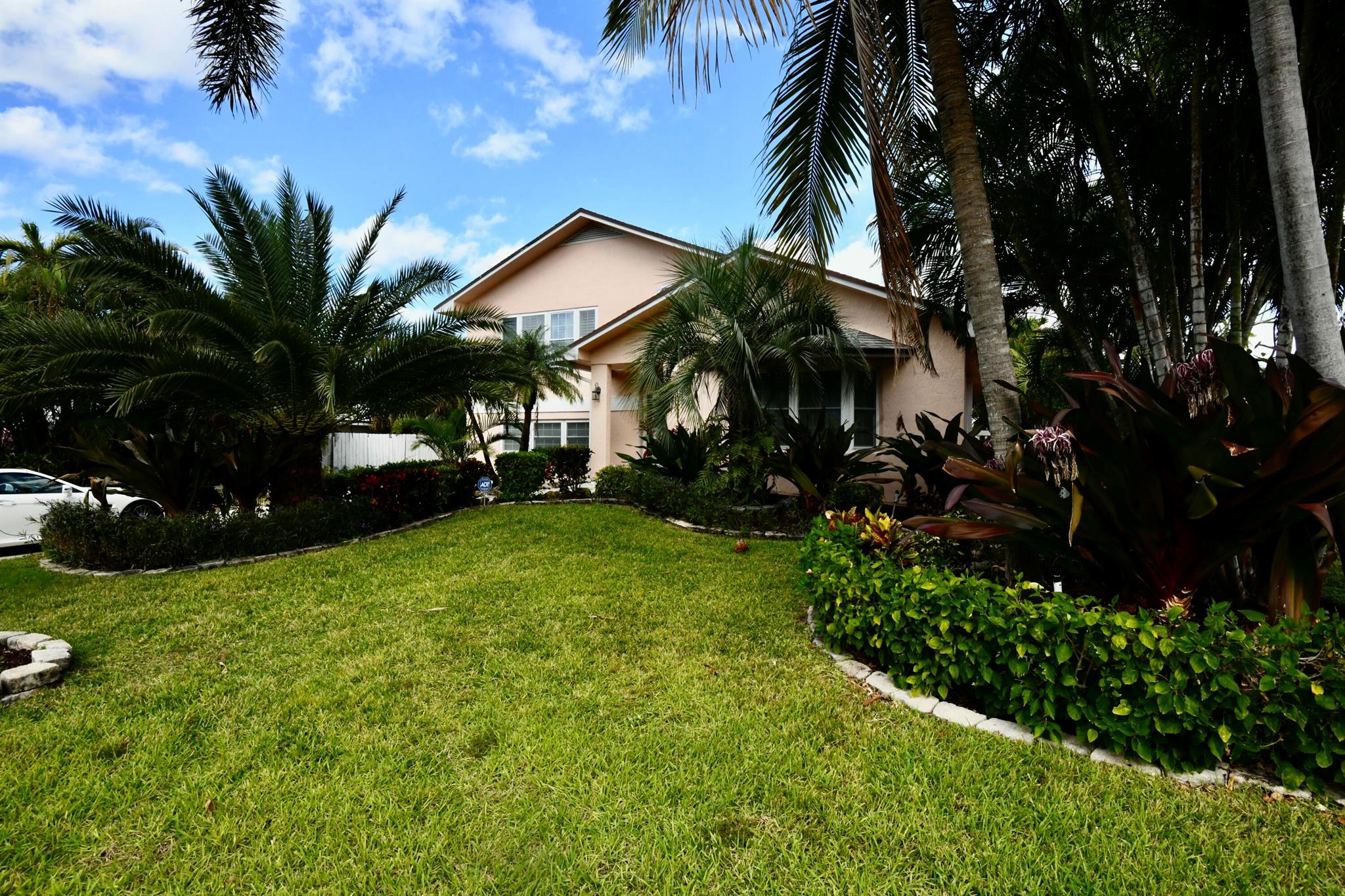 A must see . Rare home in Palm Beach Shores. split level, with 4 bedrooms 2.5 baths... 3 garage spaces. Heated Pool with Spa Truly rare in PBS. Large bedrooms.master 24x14 , 2nd bedroom 23x13 3rd bedroom 12x12.  all furniture conveys. This home is updated.with Bay window, plantation shutters,  like new appliances. hurricane shutters, plenty of parking 4th bedroom could be a den, an office or bedroom as it has a closet, window and a door to the outside or into the garage. wood floors in upper level. home is very open and high ceilings. ADT Alarm system. backyard is mostly trees and is low maintenance. no grass in backyard . Plenty of parking , pool equipment fenced and pool area is also fenced with vinyl fence . Not in a flood zone. Nautral gasthis home is a great home a must to see.