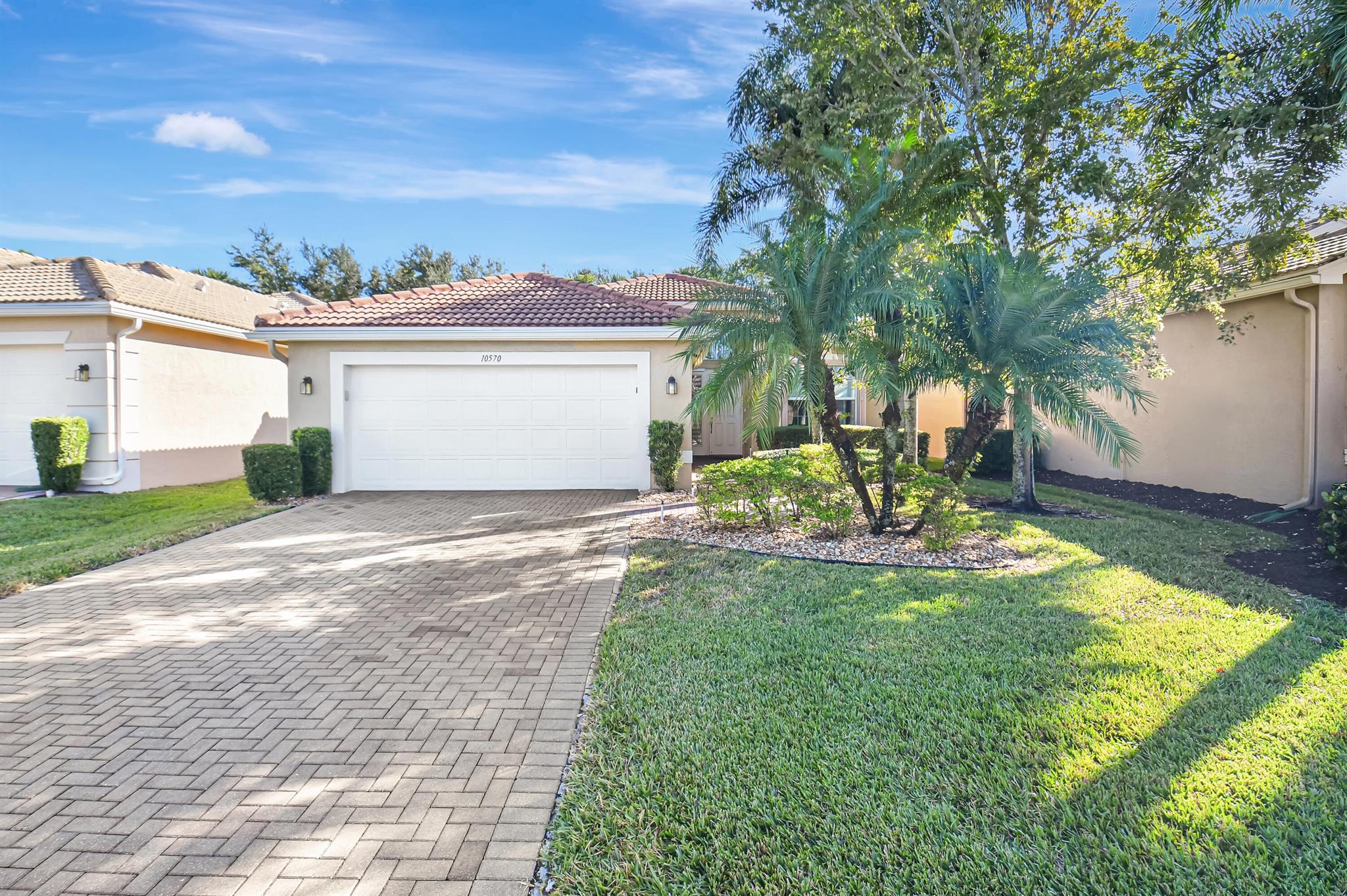 Move right into this lovely one-story home conveniently located close to the Valencia Reserve clubhouse. 2-bedrooms + den, volume ceilings,split bedroom plan, and extended screened-in lanai with travertine stone flooring and private garden setting. Eat-in kitchen is open to the family room and features stainless steel appliances, 42'' cabinets, tumbled marble backsplash, and counter seating. Master bedroom with two walk-in closets, laminate flooring and bay window. Master bath with marble countertops and upgraded finishes. 2021 AC & full hurricane protection. Experience this active 55+ community with fabulous amenities! Resort style pools plus resistance pool, cafe, fitness center,tennis,pickleball,card rooms,live shows,lots of clubs and more!Clubhouse renovation renderings in documents