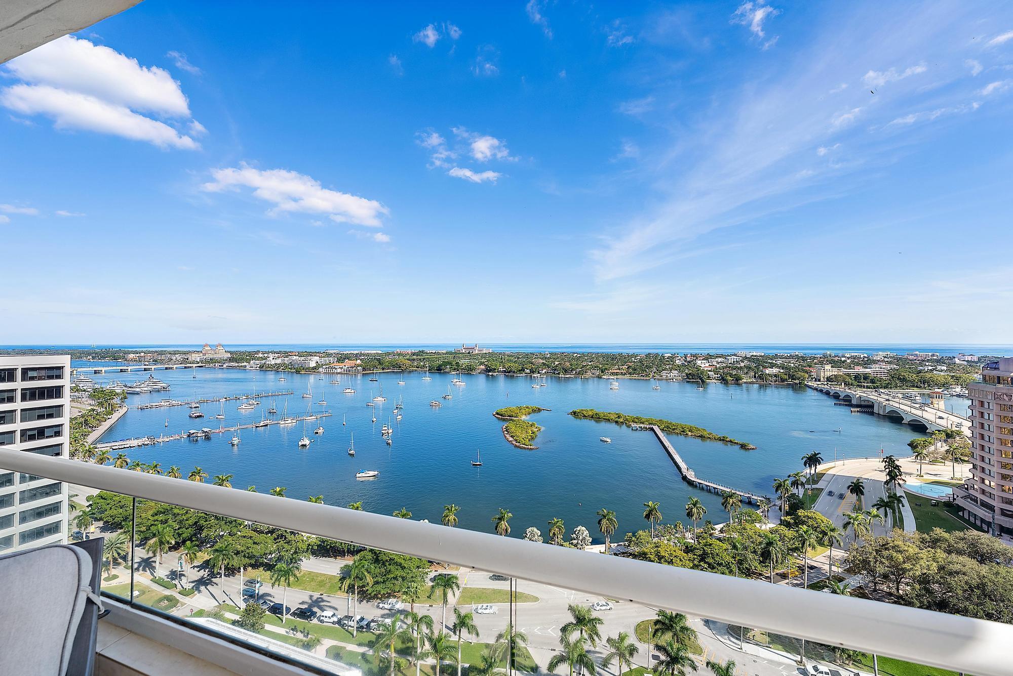 Experience Epic unobstructed Intracoastal & Ocean views from this 23rd floor S/E corner 2 bedroom, 2.5 bath ''Turnkey''. Immaculate interiors and a sophisticated open floor plan features a stunning oversized kitchen island, custom cabinetry, top appliances, sleek fixtures & finishes, motorized solar shades, porcelain flooring, separate laundry, pantry and abundant storage throughout. Conveniently located in the heart of vibrant West Palm Beach...residents can enjoy an array of world- class amenities including 24/7 gated security,  concierge, fitness center, sauna, tennis, pickleball, and both east and west side pools. Valet and assigned parking + pets permitted.