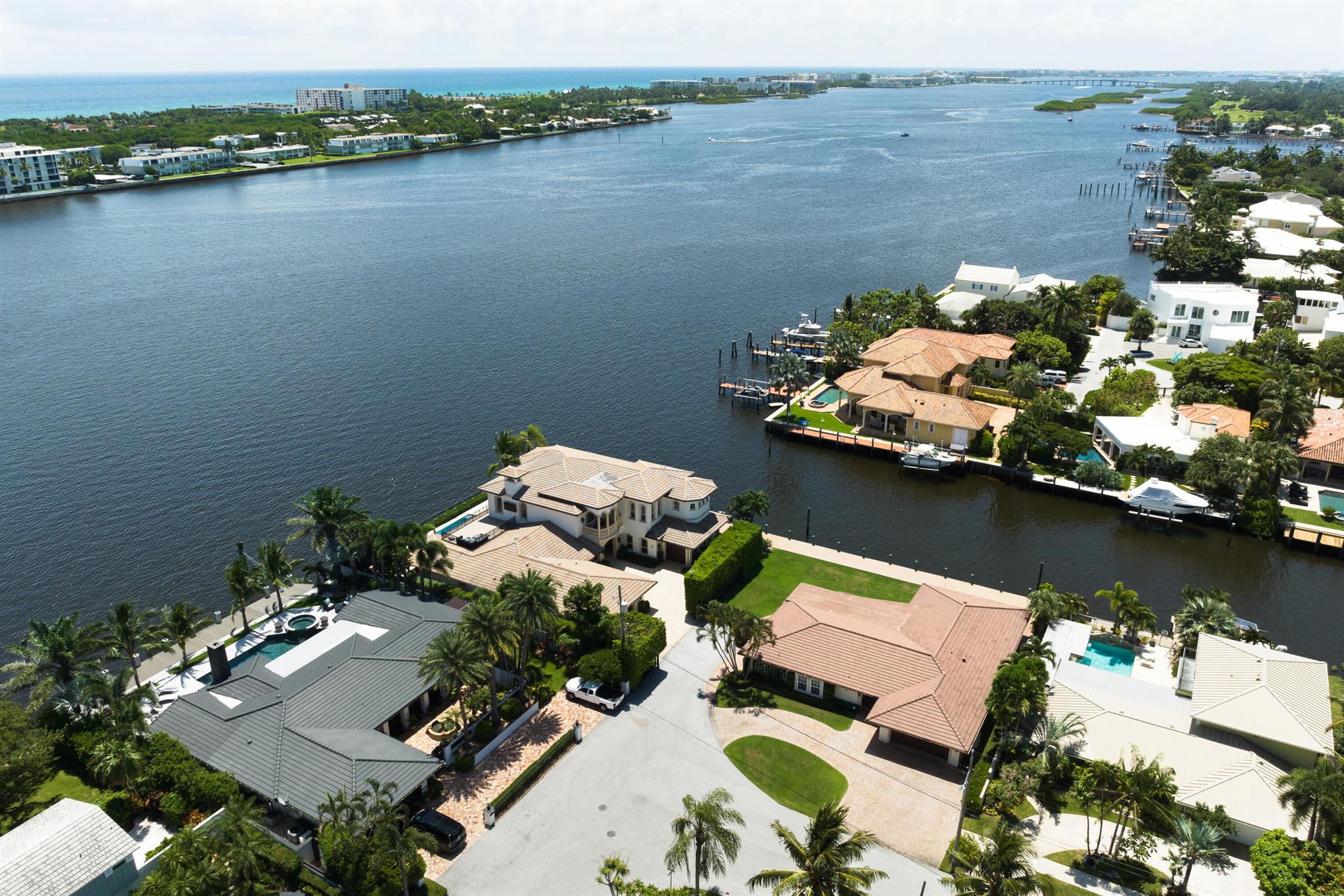 Experience direct Intracoastal living & unprecedented privacy featuring 325' of waterfront & 200' of dock 15 min to downtown, Worth Ave & PBI Offering both a primary & secondary residence with a combined 8300+ SF of living space and preferred Southeast waterfront exposure . The primary residence is host to a 17' backlit quartzite island, water's edge dining & living areas, a 5-room owners suite with panoramic vista's and an ocean-facing rooftop terrace! Reimagined, the secondary residence offers its own waterfront living areas, kitchen & pool. The estate boasts waterside kitchens & great rooms surpassed only by the 300' of coastal loggia's and an elevated dock connecting the dwellings. The primary residence also available separately.  Seller offering tax incentives to qualified buyers.