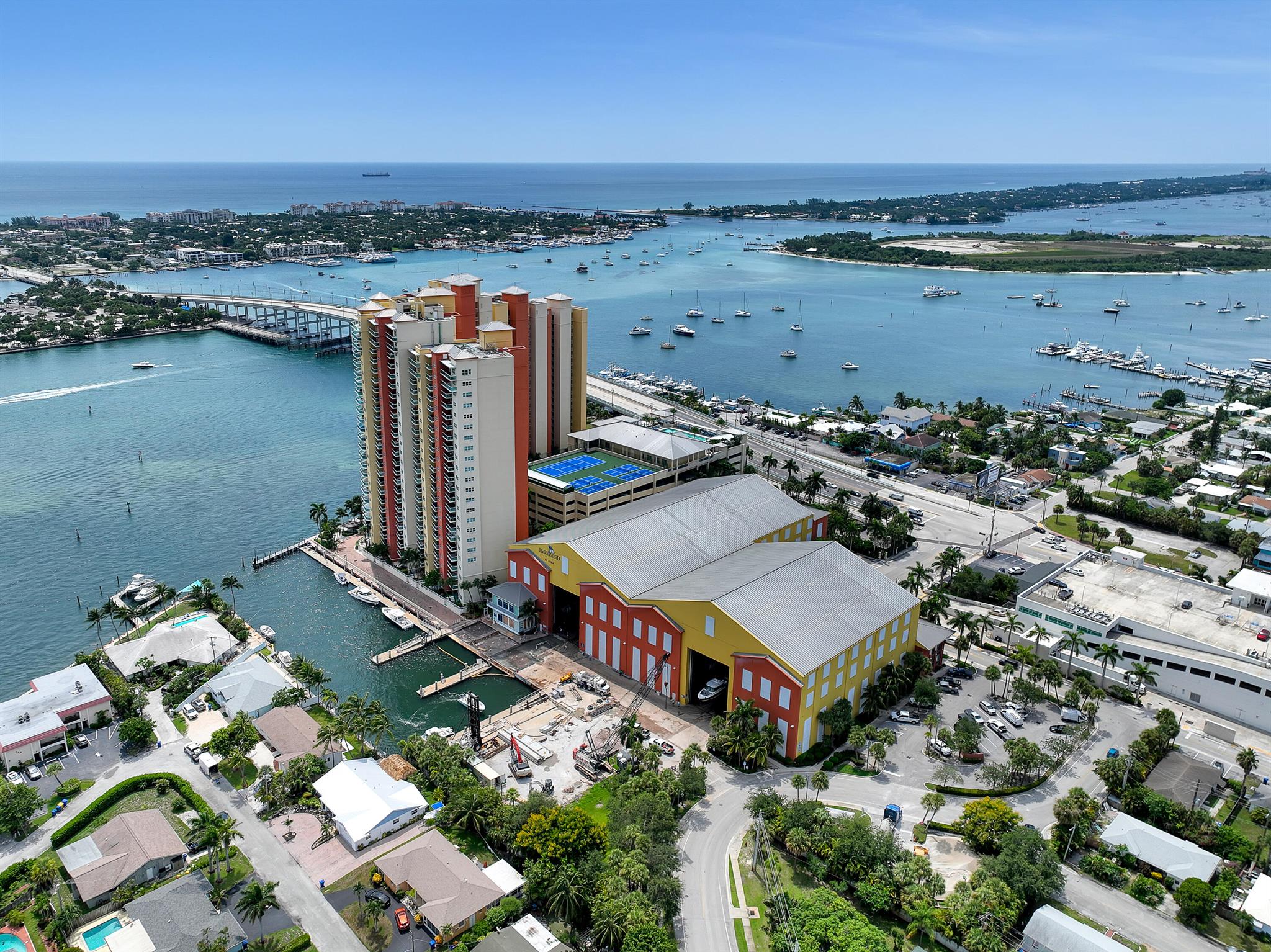 Experience premier luxury waterfront living in this stunning 3rd-floor Marina Grande corner unit. Spacious 2-bedroom + den offers breathtaking NE views and serene Intracoastal outlook that shields you from harsh east winds and direct sunlight. Boaters will love the prime location -- see your boat from your balcony conveniently near the full-service dry dock marina, the largest of its kind in the area. Docking, loading, and unloading supplies has never been easier with this unique vantage point. Unit offers remodeled baths, new flooring, generous balcony, elegant marble finishes. Resort-style amenities include clubhouse, fitness studio, sauna, spa, heated pool, tennis and pickleball. Engineering cert paid and conducted ahead of schedule ensures peace of mind with no current assessments.