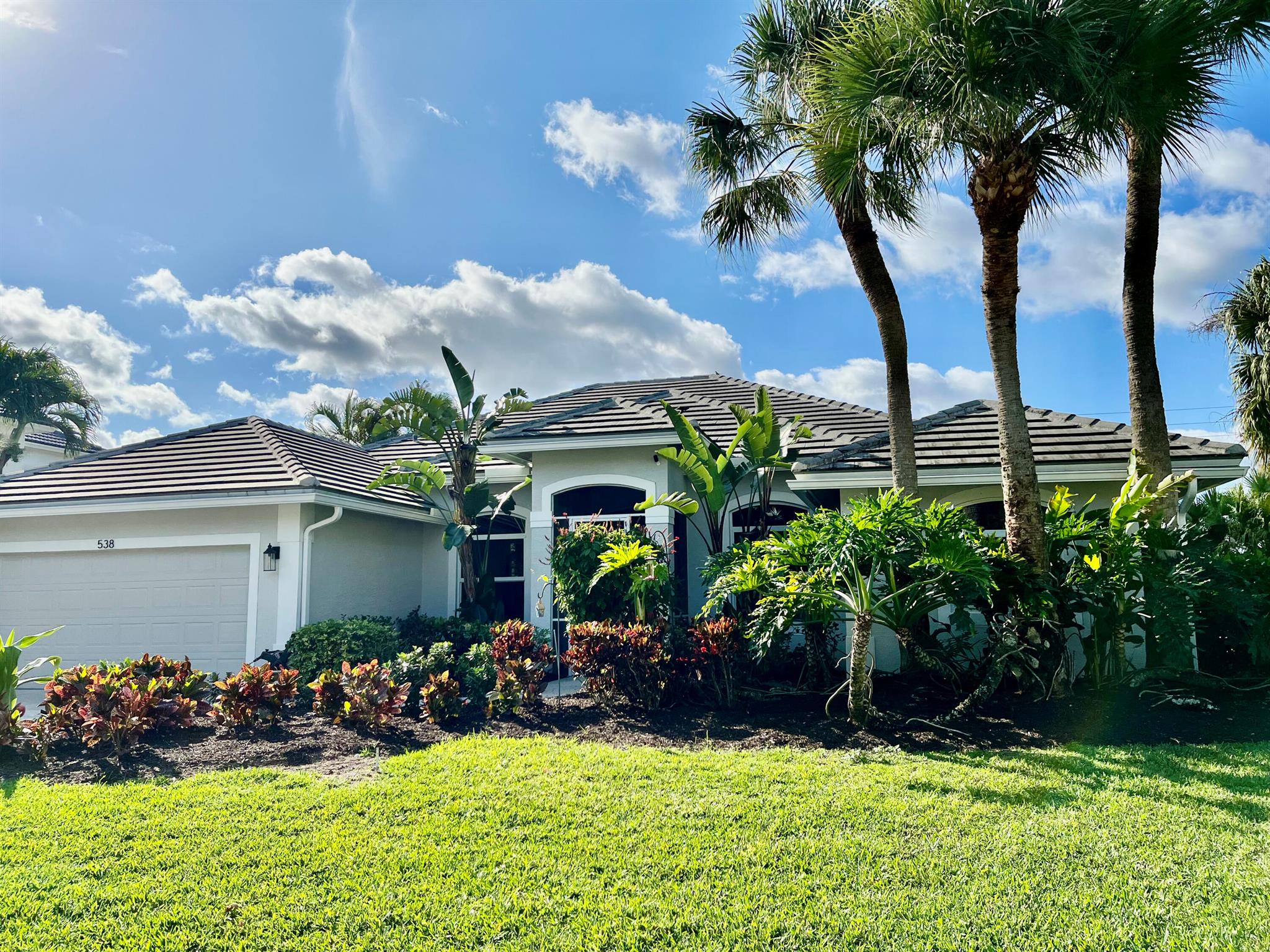 Egret Landing, Desirable one story living! This rare piece of property has been meticulously maintained by the original owner. Volume ceilings & 8' sliders flood the living area with natural light.  Bosch and Kitchenaide appliances are a chefs delight along with the large granite island.  Impact glass, 2022 roof, 2023 AC's in main and in-law suite. Guest Suite has private entrance, 8'0 sliding doors overlooking the pool, new appliances, washer/dryer, full bath and volume ceilings.Main house boasts 32'' porcelain, zero grout tile, open concept, freshly painted interior and exterior,  expansive 8'0 sliders, new hot tub, new pool pump, pool tile, additional insulation including over garage..much more!  A MUST SEE!Loads of upgrades and additions accompany this move in ready home