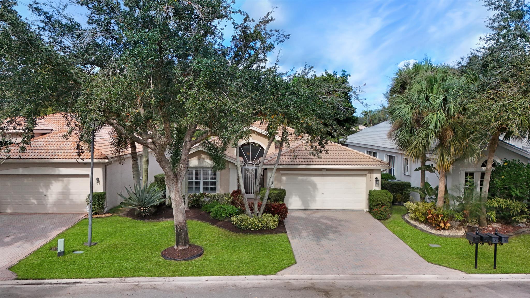 Welcome to 7273 Kea Lani Drive, a stunning 3-bedroom, 2-bath home in Boynton Beach's desirable 55+ Valencia Isles. This South Pacific model is bright and airy featuring a spacious open layout, a chef's kitchen with a quartz topped center isle and a breakfast nook overlooking the lush private backyard. The master suite offers a spa-like en-suite with his and hers walk-in closets.  Plantation shutters and high hat lighting are throughout the home. Featuring a private backyard with lush landscaping and a screened in lanai creating a serene retreat.  Accordion Shutters for Storm Protection.Enjoy resort-style amenities, including a newly renovated clubhouse, pools, pickleball,  tennis courts, and fitness center. Close to dining, shopping, and beaches--schedule your private showing today!!