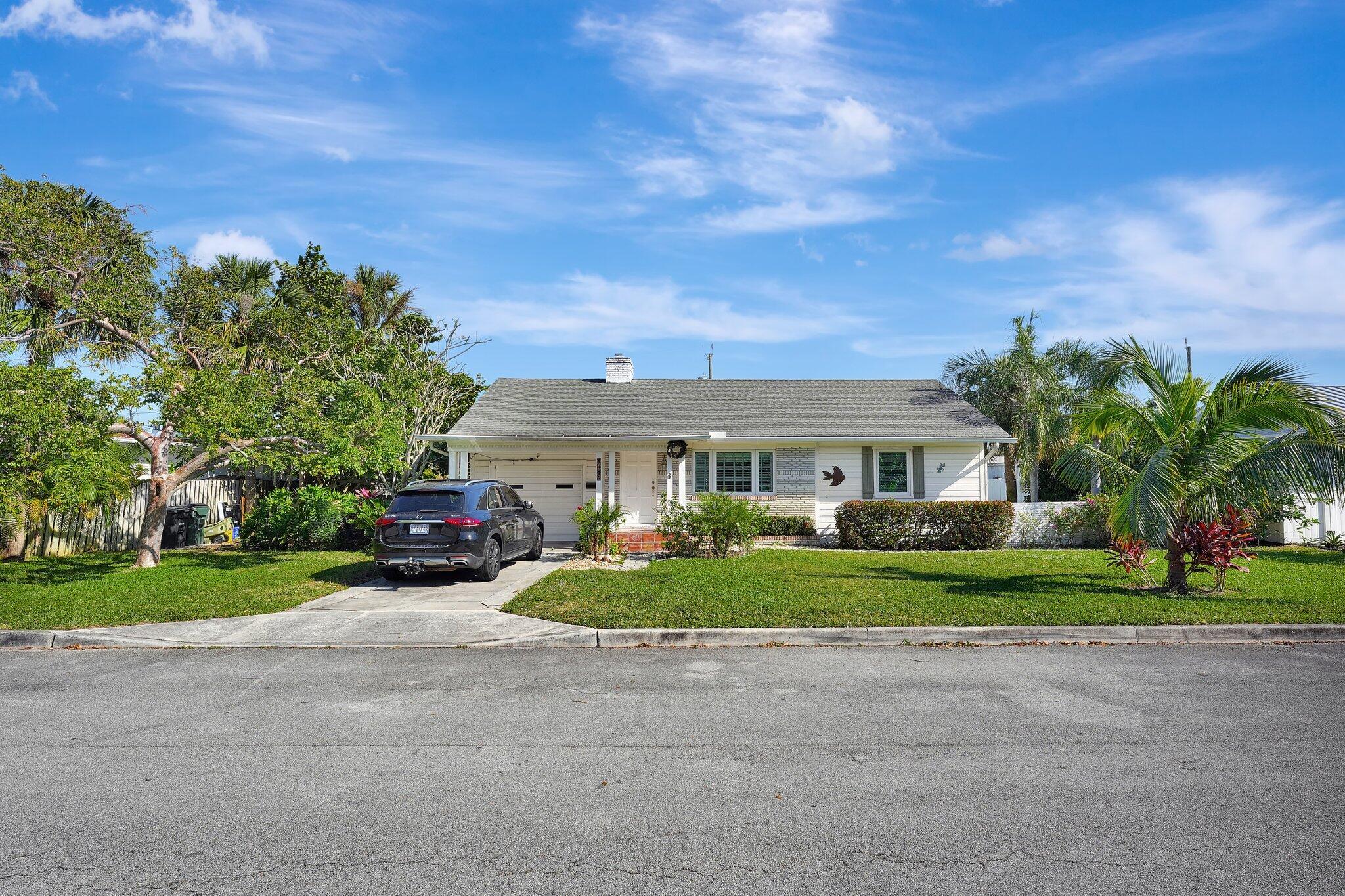 A one-of-a-kind gem in the heart of the highly coveted historic Parrot Cove neighborhood of Lake Worth Beach. This residence seamlessly blends vintage charm with modern potential.  Situated on a rare double lot, this property offers an expansive outdoor space ideal for creating your private paradise. Whether you envision an expansion, sparkling pool, lush tropical landscaping, or an outdoor entertaining area, the possibilities are endless.  Step inside to discover the timeless beauty of original Dade County pine wood flooring, an architectural treasure that adds warmth and character. The home boasts abundant natural light, accentuating the charming details that reflect its historic roots. Nestled just blocks from the intracoastal, you'll enjoy cooling breezes and serene views  as you explore. This prime location offers unmatched proximity to the vibrant downtown area for boutique shopping, trendy dining, and year-round cultural events. 

For outdoor enthusiasts, Bryant Park and the scenic Lake Worth Lagoon and gorgeous beaches are minutes away. 

This home is a rare find, combining historic charm, an unbeatable location, and room to grow. Whether you're seeking a serene retreat, an entertainer's dream, or a vibrant coastal lifestyle, this property is a must-see.