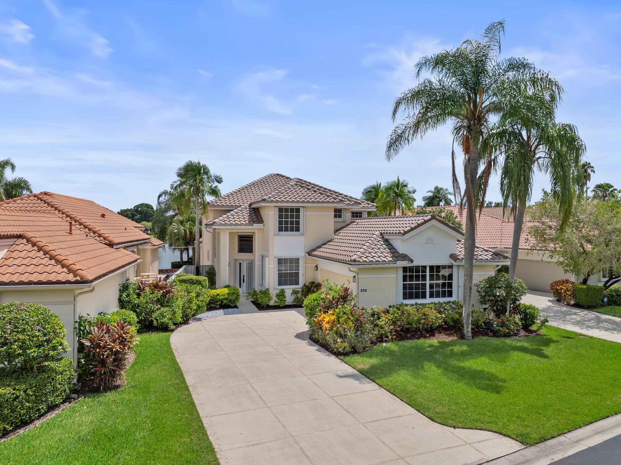 This stunning home boasts 3 bedrooms, 3.5 bathrooms, loft (could be 4th bed), den/study area, and 2 car garage. This renovated lake view gem features an array of upgrades; pristine new kitchen with large quartz island, new kitchen aid appliances, spa-like bathrooms, decorative tile accent walls, 24x48 porcelain tile floors, modern interior doors, new light fixtures, plumbing fixtures, and chic stair railings. The loft and study offer versatile living spaces. The large screened in patio overlooks a lake, perfect for enjoying serene evenings. AC 2020, WH 2017, BRAND NEW ROOF & accordion shutters for peace of mind. This oasis is truly one of a kind. Situated in the coveted neighborhood of Eagleton Lakes of PGA National, you're just moments away from top-rated schools, parks, and restaurants.