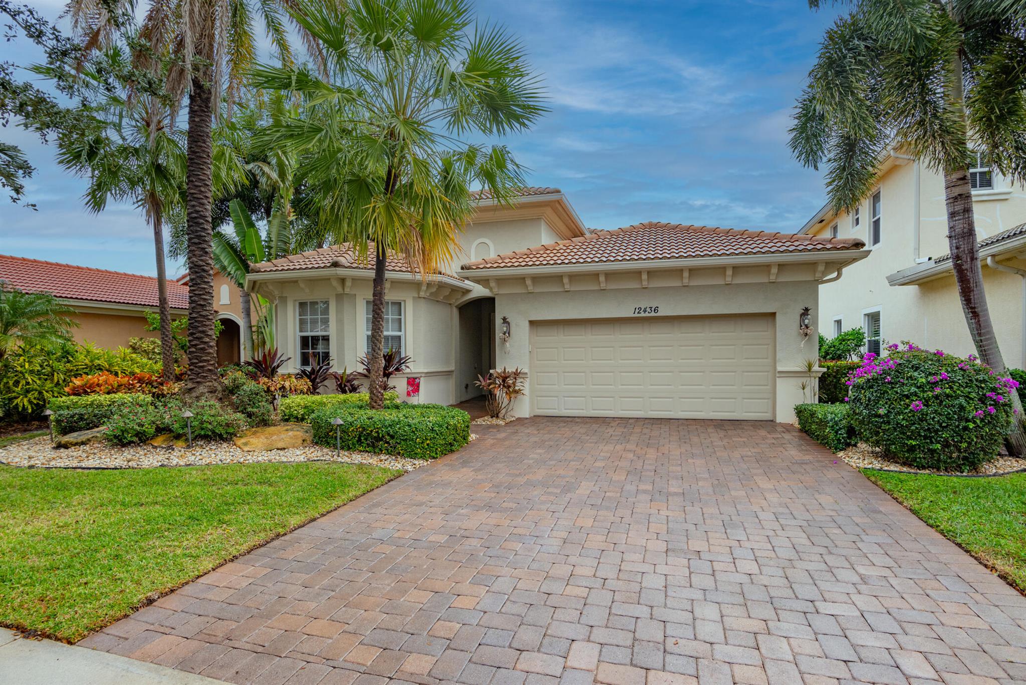 Welcome home to this stunning single story CBS house with marble flooring, impact windows and multiple living and dining areas. Enjoy coffee or cocktails lakeside from  your extended patio.  For a little more shade or privacy, just electronically lower your patio screens.  This exclusive Palm Beach Gardens neighborhood  also features a beautiful clubhouse and pool.  You are only minutes to the crystal blue waters of the Atlantic and the dozens of emerald green fairways of Palm Beach County. Walk...don't run to this show stopper if you are in need of a full time or seasonal home, which is also available fully furnished.