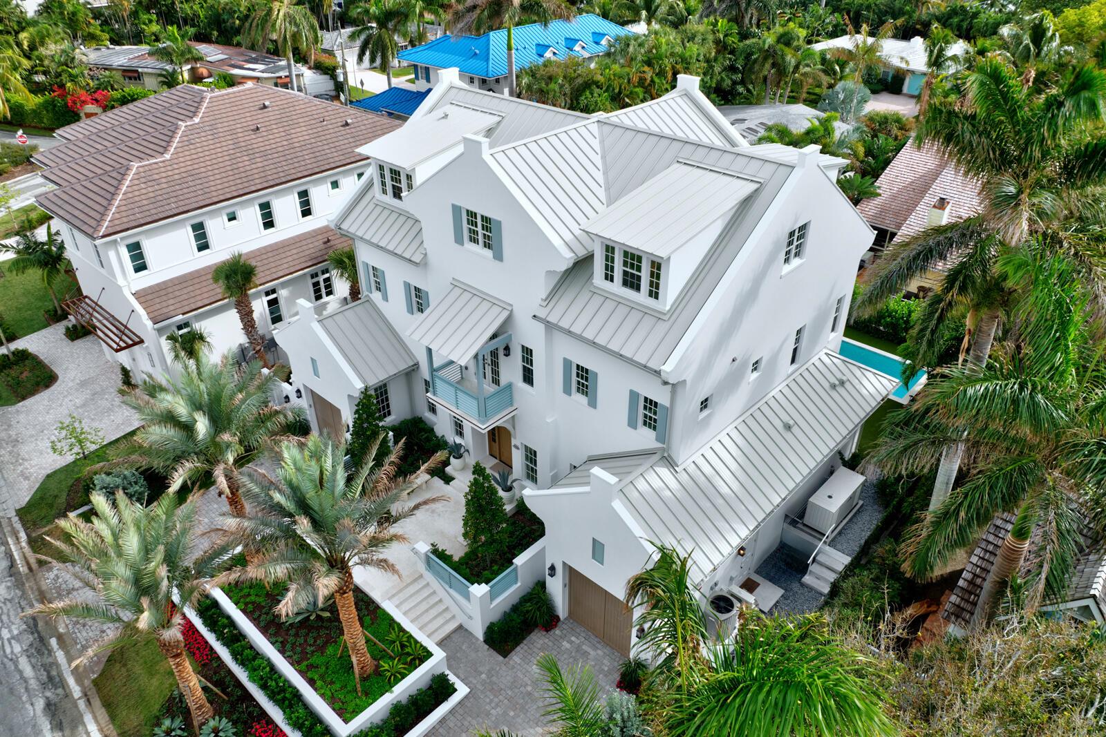 Exceptional opportunity to own a new Custom Masterpiece built to the highest standards by and for Delray's most revered builder, Lost Craft Builders, as his family's personal residence with no expense spared. Just a block and a half from the ocean, and 3 blocks from beloved Atlantic Avenue, the home is located within the heart of the prestigious North Beach neighborhood. This serene, one of a kind 5BR/6.1 Bath home offers an unparalleled living experience with luxurious finishes, graciously proportioned rooms and impeccable craftsmanship. The thoughtfully designed Main floor's Great Room with lofty Beamed Pecky Cypress Ceiling, is poised for seamless entertaining with Chef's Kitchen, Living Area w/Natural Gas Fireplace and Dining Area  drenched in natural light by a 20' Wall of sliding Glass Doors that open out to a Covered Loggia with a fabulous Summer Kitchen and Serene Pool and garden views. The Chef's Kitchen is a culinary dream, equipped with Natural Gas Wolf and Subzero appliances, Quartzite Countertops, Custom Millwork, separate Bar Area w/ Wine Cooler and an enormous Island which seats 7 for large gatherings. The Butler's Pantry, Laundry, Office, Powder Room, Cabana Bathroom and Ensuite VIP Bedroom complete the main floor. 
 
The 2nd floor features a spectacular Primary Suite and 2 additional spacious En-Suite Bedrooms all w/ Walk-in Closets, vaulted ceilings and access to the outdoor south-facing Covered 2nd- floor Balcony. The luxurious Primary Suite w/ separate Reading Nook captures spectacular Sunrises and Sunsets through the east, south and west exposures. The spacious Ensuite Marble Bathroom features custom Dual-sink Vanity w/ Makeup Area, inlaid marble mosaic flooring and separate Walk-in Closets w/custom built-ins.

Spectacular top floor, set under the charming angels of the roof rafters and dormer windows enjoys 360* open vistas with a light-filled Family Room, charming Bed/Bunk Room, Full Bath, Kitchenette, Game Room/Gym.  The generous size and openness of the layout of this bonus area conjure limitless and versatile uses.

The outdoor and indoor spaces blend seamlessly for easy entertaining with Covered Porch w/ Outdoor Kitchen, Roll-down Hurricane Shades, Heated Pool with Spa, Covered Porch, Balconies and Lush, Mature Landscaping and Landscape Lighting. For driving enthusiasts, there is Garaging Potential for 4 cars complete w/air-conditioned and gleaming epoxy floors.

This masterfully constructed home is built beyond the current wind code requirements including a solid poured concrete structure, concrete floor system, upgraded sound proofing between walls, full impact rated windows and doors and an exceptionally high Flood Elevation of 8'36 NAVD.  

State of the art systems complete this masterpiece, including Lutron lighting, Audio System, Security with CCTV, Fire Sprinkler System, Full-House Generator, Elevator and Roll Down Hurricane Shades.

This Spectacular Home, built for and by Delray's most discerning Builder, is move-in ready.  

ADDITIONAL PHOTOS TO FOLLOW 12/17/24. BUYER TO PAY 1.5% DEVELOPER'S FEE AT CLOSIG.  ALL INFORMATION SHOULD BE VERIFIED BY BUYER.