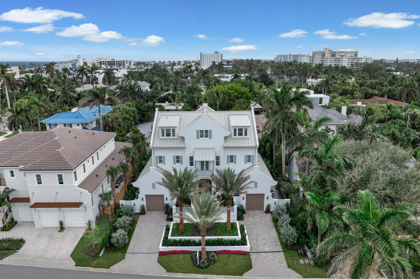 Exceptional opportunity to own a new Custom Masterpiece built to the highest standards by and for Delray's most revered builder, Lost Craft Builders, as his family's personal residence with no expense spared. Just a block and a half from the ocean, and 3 blocks from beloved Atlantic Avenue, the home is located within the heart of the prestigious North Beach neighborhood. This serene, one of a kind 5BR/6.1 Bath home offers an unparalleled living experience with luxurious finishes, graciously proportioned rooms and impeccable craftsmanship. The thoughtfully designed Main floor's Great Room with lofty Beamed Pecky Cypress Ceiling, is poised for seamless entertaining with Chef's Kitchen, Living Area w/Natural Gas Fireplace and Dining Area  drenched in natural light by a 20' Wall of sliding Glass Doors that open out to a Covered Loggia with a fabulous Summer Kitchen and Serene Pool and garden views. The Chef's Kitchen is a culinary dream, equipped with Natural Gas Wolf and Subzero appliances, Quartzite Countertops, Custom Millwork, separate Bar Area w/ Wine Cooler and an enormous Island which seats 7 for large gatherings. The Butler's Pantry, Laundry, Office, Powder Room, Cabana Bathroom and Ensuite VIP Bedroom complete the main floor. 
 
The 2nd floor features a spectacular Primary Suite and 2 additional spacious En-Suite Bedrooms all w/ Walk-in Closets, vaulted ceilings and access to the outdoor south-facing Covered 2nd- floor Balcony. The luxurious Primary Suite w/ separate Reading Nook captures spectacular Sunrises and Sunsets through the east, south and west exposures. The spacious Ensuite Marble Bathroom features custom Dual-sink Vanity w/ Makeup Area, inlaid marble mosaic flooring and separate Walk-in Closets w/custom built-ins.

Spectacular top floor, set under the charming angels of the roof rafters and dormer windows enjoys 360* open vistas with a light-filled Family Room, charming Bed/Bunk Room, Full Bath, Kitchenette, Game Room/Gym.  The generous size and openness of the layout of this bonus area conjure limitless and versatile uses.

The outdoor and indoor spaces blend seamlessly for easy entertaining with Covered Porch w/ Outdoor Kitchen, Roll-down Hurricane Shades, Heated Pool with Spa, Covered Porch, Balconies and Lush, Mature Landscaping and Landscape Lighting. For driving enthusiasts, there is Garaging Potential for 4 cars complete w/air-conditioned and gleaming epoxy floors.

This masterfully constructed home is built beyond the current wind code requirements including a solid poured concrete structure, concrete floor system, upgraded sound proofing between walls, full impact rated windows and doors and an exceptionally high Flood Elevation of 8'36 NAVD.  

State of the art systems complete this masterpiece, including Lutron lighting, Audio System, Security with CCTV, Fire Sprinkler System, Full-House Generator, Elevator and Roll Down Hurricane Shades.

This Spectacular Home, built for and by Delray's most discerning Builder, is move-in ready.  

ADDITIONAL PHOTOS TO FOLLOW 12/17/24. BUYER TO PAY 1.5% DEVELOPER'S FEE AT CLOSIG.  ALL INFORMATION SHOULD BE VERIFIED BY BUYER.