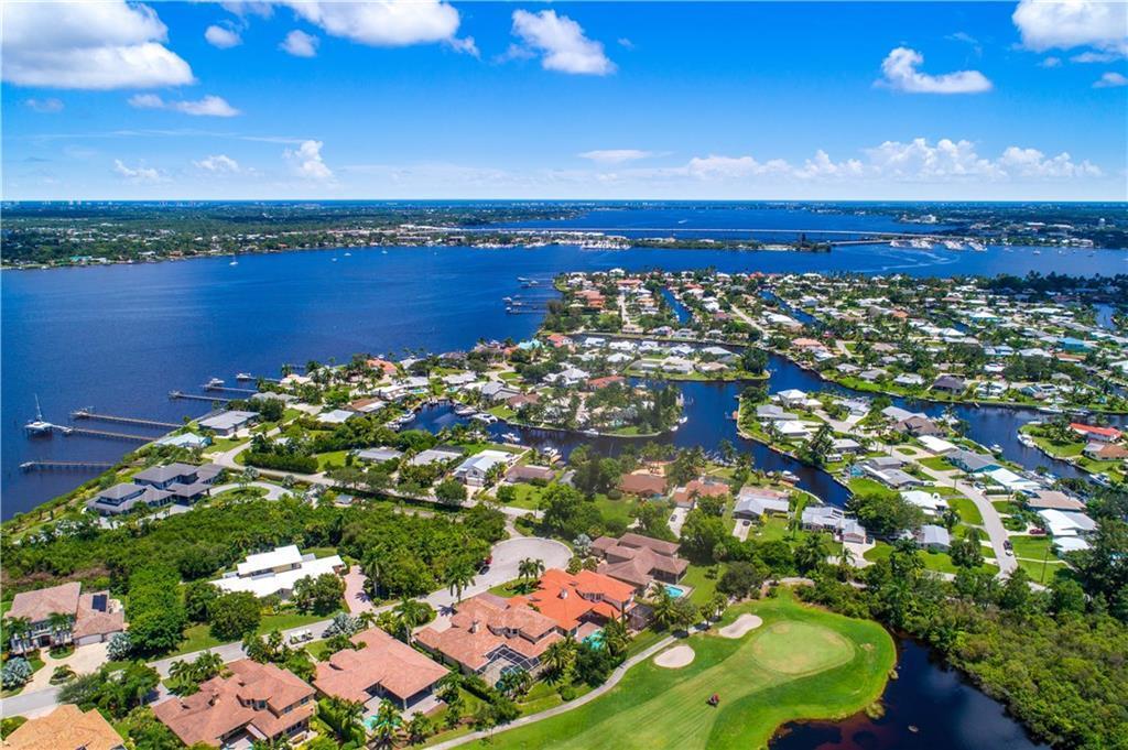 Bring your boat! Palm City's prestigious Palm Cove Golf & Yacht Club has a 93-slip marina w/easy ocean access. This pristine single-story Toll Brothers-built home is a blank slate w/wide open floorplan, volume ceilings & walls of sliders, filling the house w/natural light. The oversized screened lanai offers privacy & tranquil preserve views. There's a spacious main suite w/sitting area, ample closets, a luxurious bath, double vanities, spa tub, and a walk-in shower. The kitchen, breakfast nook & dining room flow seamlessly into the great room, while a flexible den doubles as a 3rd bedroom. Upgrades include newer kitchen appliances, a tankless water heater & epoxy-coated garage floors. Enjoy resort-style amenities like a riverfront clubhouse, fitness center, heated pool, tennis courts,