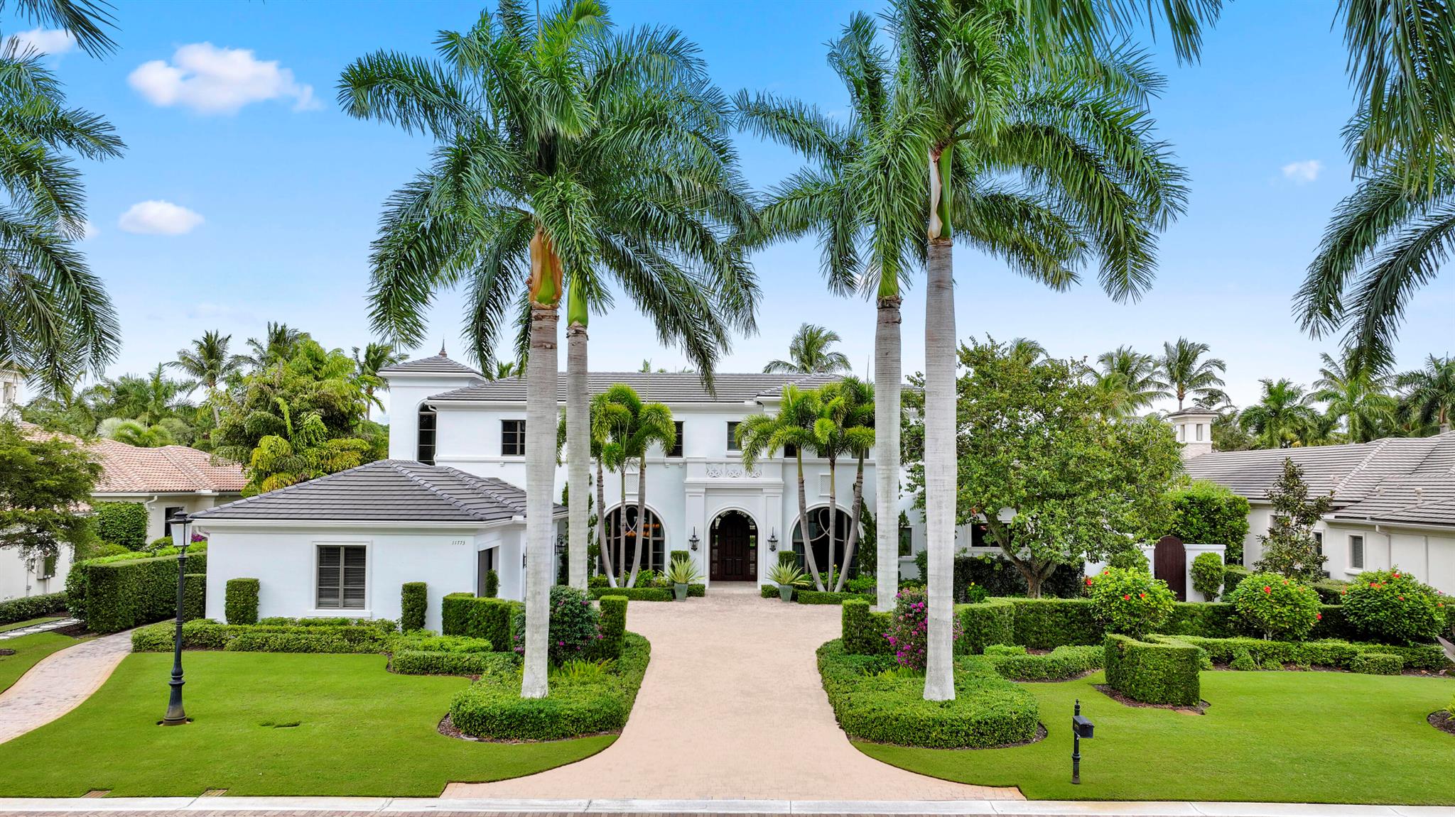 Step into a masterpiece of design and sophistication, located in the exclusive Old Palm Golf Club in Palm Beach Gardens, Florida. This custom-built estate is a testament to luxurious living, offering five bedrooms, private office, club room, and an owner's lounge, seven and a half bathrooms, and 6,474 square feet of thoughtfully curated living space. Every detail has been meticulously crafted to create a seamless blend of elegance and comfort, perfectly suited for the South Florida lifestyle.The first-floor primary suite is a true retreat, featuring his and her bathrooms, a private study with tranquil water and fire feature views, and direct access to the serene outdoor living areas. An additional guest suite and a versatile club room are also conveniently located on the first floor, providing privacy and entertainment options for family and friends. The home is equipped with an elevator, ensuring effortless access to all levels.

The gourmet chef's kitchen is fully equipped with dual islands, dual dishwashers, a coffee bar setup, and luxurious finishes, making it perfect for entertaining. Wine enthusiasts will appreciate the temperature-controlled wine cellar, ideal for storing and showcasing an extensive collection.

The expansive family room opens to an outdoor screened living space through massive pocket doors, creating the ultimate setting for indoor-outdoor living. A wet bar with an ice maker enhances the entertaining experience. The outdoor area features a fully equipped kitchen, a double-sided fireplace, a sparkling pool and spa, and a beautifully landscaped garden.

Additional highlights include a brand-new roof, luxurious finishes throughout, a three-car garage with additional space for a golf cart, and unparalleled craftsmanship. Old Palm Golf Club is a renowned gated community with a newly renovated clubhouse, a state-of-the-art fitness center, a Raymond Floyd designed championship golf course, private dining options, and a club room for relaxing after a round of golf.

This prime location is just minutes from world-class dining, Palm Beach Island, pristine beaches, and airport access. Perfectly priced to sell, this property offers exceptional value for its next owner to enjoy the ultimate South Florida lifestyle.