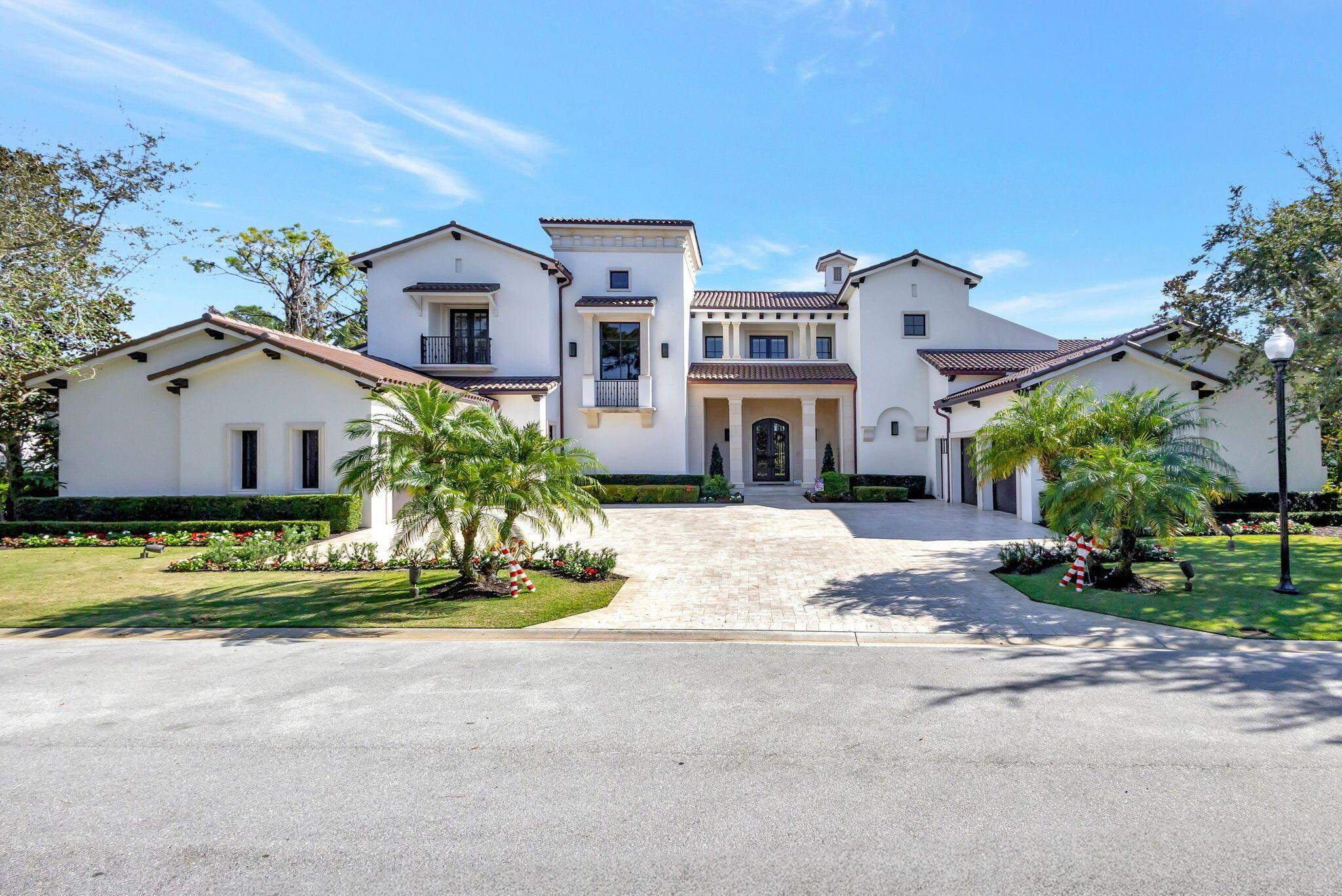 Enjoy the elegance of this custom, over 9,000 square ft estate located in the exclusive Bears Club in Palm Beach Gardens. Featuring five bedrooms, 7.2 bathrooms, 2 - 2 car garages. This spectacular home is situated on a beautiful lot with privacy and a resort-style backyard with outdoor loggia and a fireplace. Recently renovated and new roof. Additional luxuries include a first-floor master suite, 2 magnificent marble master bathrooms, a guest suite, a media room, a club room, a chef's kitchen, a wine bar with a built-in wine fridge, soaring ceilings, impact glass, an elevator, and much more! Beautifully appointed with amenities too numerous to list and ready for the most discerning buyer