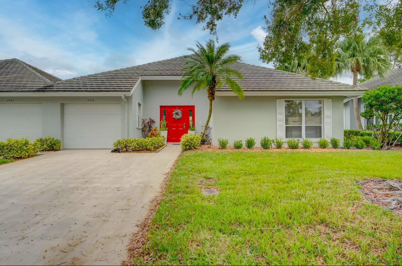 Experience luxury living in Martin Downs Country Club with this lightly lived-in 2-bedroom, 2-bathroom villa featuring a 1-car garage. This end-unit gem offers cathedral vaulted ceilings, bamboo flooring, a remodeled primary bathroom, and a state-of-the-art kitchen with new appliances, including an induction oven. Entertain in style with a bright living area, versatile family room/den, and a newly built screened lanai showcasing custom mosaic tile and serene golf course views. Enjoy peace of mind with a hurricane-impact front door, partial impact windows, a new electrical panel, fresh paint, and a new washer and dryer. Furniture is negotiable, making this home move-in ready. HOA fees include exterior maintenance to keep insurance costs low, and optional memberships provide access to The Village Club &amp; Preserve with pools, tennis, pickleball, basketball, a fitness trail, a dog park, and more. Conveniently located near I-95, the Florida Turnpike, and highly-rated schools, this villa offers the ultimate Florida lifestyle. Schedule your tour today!