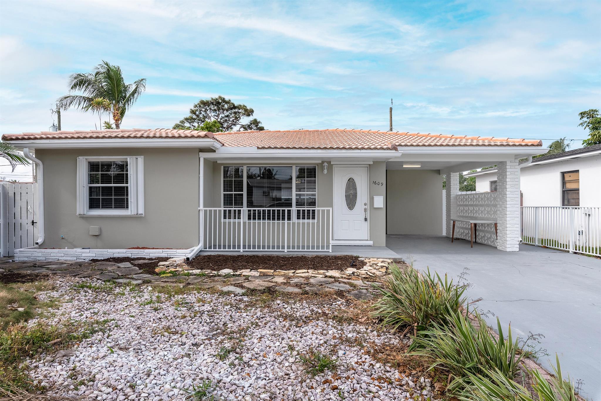 Charming single-family home in historic Lake Worth, just minutes from vibrant downtown. This 2-bedroom, 2-bathroom concrete block home with an S-tile roof offers modern updates and no HOA--perfect for immediate rental or personal use. The updated kitchen features granite countertops and stainless steel appliances, while the two well-appointed bathrooms and new flooring throughout add style and comfort. Enjoy a Florida room ideal for an office or den, a freshly painted interior/exterior, a new AC system, and a fenced backyard. Plus, a large backyard structure offers potential as a future ADU or in-law suite. Don't miss this gem!