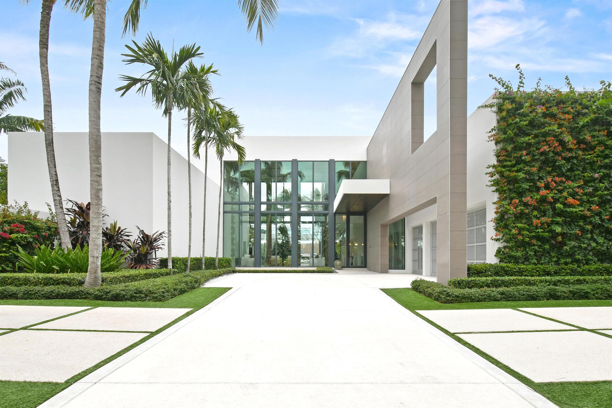 In a league of its own, this architectural masterpiece in Jupiter's prestigious Admirals Cove features a sleek modern design, soaring ceilings, and 100 ft of waterfront with no fixed bridges for quick Atlantic access, making it a boater's dream. Highlights include 5 bedrooms, a luxurious first-floor master suite, VIP guest room, a chef's dream kitchen with Italian Valcucine cabinetry, backlit onyx countertops, and Wolf appliances, exquisite wood and stone finishes, a temperature-controlled wine wall, Crestron automation, and elevator. Step out back and be dazzled by the resort-style backyard, complete with a pool, spa, sundeck, summer kitchen, cabana bath, loggia with retractable screens, a private dock, lift and partial Intracoastal views. Offered furnished--when only excellence will do The Club at Admirals Cove is a private community located in Jupiter, Fl, offering a world-class membership experience and an extensive range of Amenities.  Required golf membership purchase conveys all the first-class amenities of Admirals Cove including two clubhouses 45 holes of golf, 5 restaurants, 58 slip marina with floating docks, Yacht Club, 9 har-tru tennis courts,12  pickleball courts, state-of-the-art fitness, physical therapy and wellness, 21,000 sq ft brand new spa &amp; salon.
30 room Waterside Private Boutique Hotel for members and their guests, golf center, coveters kids club, dog park. 
Total convenience at your fingertips.  Close to Palm Beach Airport.