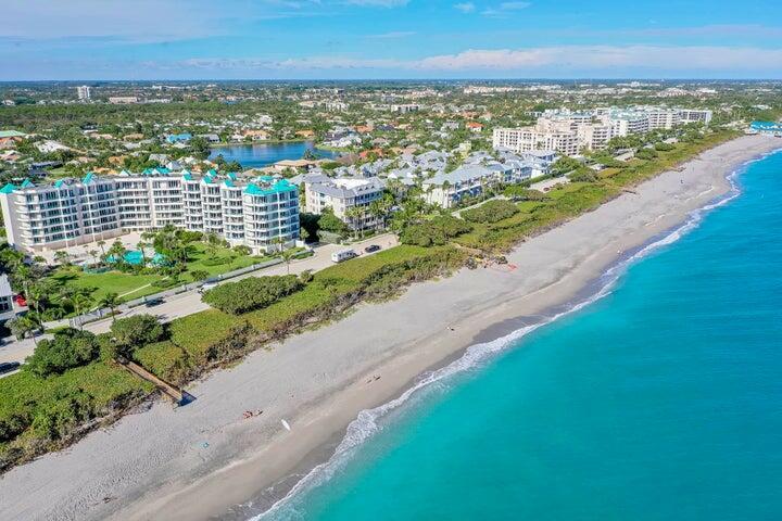 Experience luxury living in this pristine PENTHOUSE beachfront oasis with stunning panoramic ocean views. Fully furnished and designed with coastal elegance, the residence features 12 ft ceilings, a beautifully renovated kitchen with solid wood cabinets, quartz countertops, glass mosaic backsplash, and a wine refrigerator. The owner's suite offers ocean views, custom walk-in closet, a spa-like bath, and balcony access. Have total peace of mind w hurricane impact glass. Ocean Club Jupiter boasts top-tier amenities, including a renovated club room, fitness center, garage parking and resort style pool. Extensive pool deck renovations are in progress (rendering in pictures and is not completely accurate), and assessments have been fully paid for by the seller!