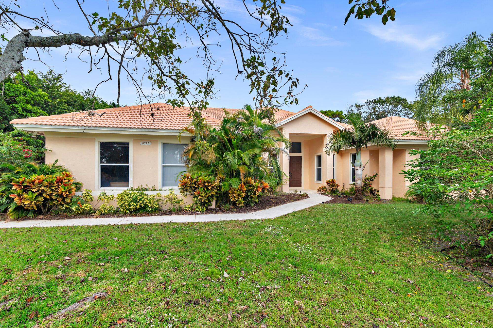 Step into a world of potential with this expansive 7-bedroom, 5-bath residence located in the highly sought-after gated community of Steeplechase. Offering over one acre of lush land, this property serves as a personal oasis, perfectly situated for easy access to vibrant downtown Palm Beach Gardens and West Palm Beach. 15 minutes from Palm Beach International Airport and the beach. Imagine the possibilities as you explore this spacious home, complete with a screened-in pool and private tennis court. The barrel roof, replaced in 2017, provides a solid foundation as you infuse your unique style and vision.