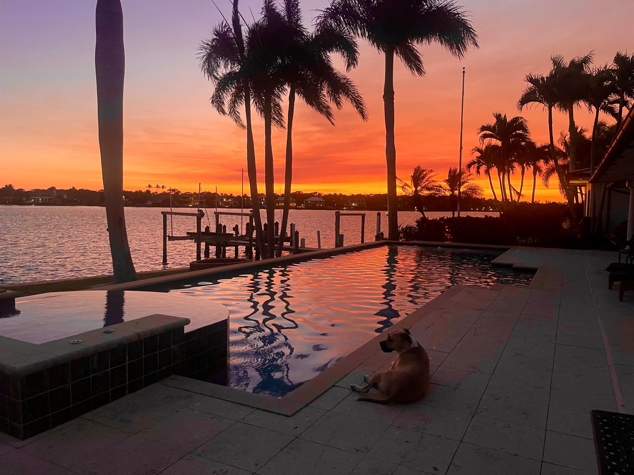 Tucked away in Tequesta Country Club, this extraordinary 193' riverfront property is a RARE FIND. Captivating panoramic, wide water sight lines from the Jupiter Inlet to Pennock Point are breathtaking. This true southern exposure offers sunrise and sunset views and is only moments from the ocean.  The convenience of a 5000 sq. ft. ONE STORY home is made possible with this oversized .55 acre lot.  Other features include expansive living and dining  areas, 5 bedrooms, office, family room, 5 full and 2 half baths, a 3 car garage, a covered poolside lanai, an outdoor fireplace, a full house generator, and a 16,000 lb lift. Discover 10 Yacht Club Place...a spectacular location loaded with potential and possibilities.