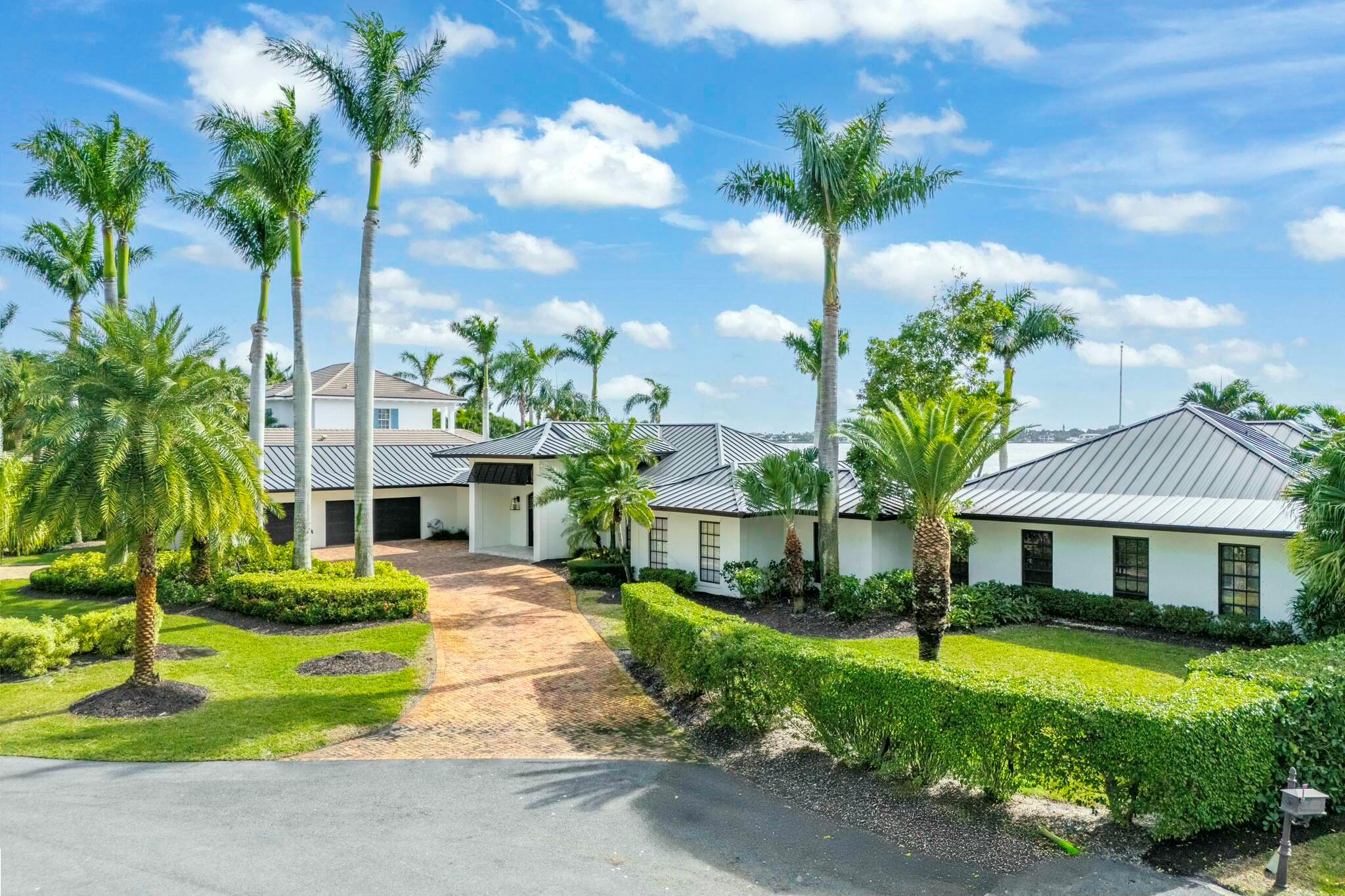 Tucked away in Tequesta Country Club, this extraordinary 193' riverfront property is a RARE FIND. Captivating panoramic, wide water sight lines from the Jupiter Inlet to Pennock Point are breathtaking. This true southern exposure offers sunrise and sunset views and is only moments from the ocean.  The convenience of a 5000 sq. ft. ONE STORY home is made possible with this oversized .55 acre lot.  2 living areas, 2 dining areas, 5 bedrooms, office, family room, 5 full and 2 half baths, a 3 car garage, a covered poolside lanai, an outdoor fireplace, a full house generator, and a 16,000 lb lift. Built in 1977, updated in 2003 (plus a large addition) updated again in 2014. Plans for a second floor addition available. This is a spectacular location, on a quiet street in a lovely neighborhood.