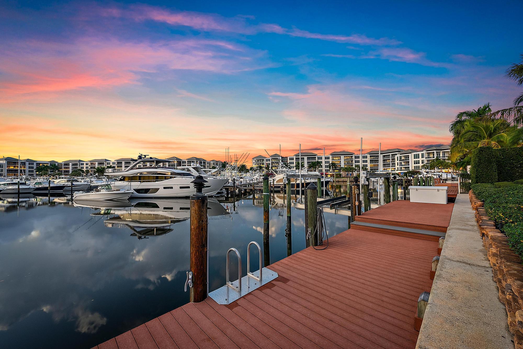 Discover a rare opportunity for deep-water, safety harbor dockage in the exclusive, premier club community of Frenchman's Creek Beach and Country Club. Nestled on an exclusive peninsula with just nine other homes, this exquisite residence is a stone's throw  from the renowned Beach Club, offering an exceptional blend of privacy and resort-style living. From the moment you step through the grand mahogany front door, you'll be captivated by the home's flawless design, perfect for entertaining. The sunken wet bar and expansive living room with soaring high ceilings create an elegant yet inviting ambiance, accentuated by Saturnia marble flooring throughout. The custom-designed kitchen, with breathtaking views of the marina, is both beautiful and functional, a true centerpiece of the home. This thoughtfully designed residence boasts two spacious guest bedrooms with en-suite bathrooms, and a luxurious primary suite complete with his-and-hers bathrooms for ultimate comfort. A conveniently located powder room adds to the home's impeccable flow. Outdoors, the heated pool with a travertine deck, summer kitchen, and raised spa provide a private oasis for relaxation and entertaining. With the completion of the new clubhouse slated for the 2025-2026 season, Frenchman's Creek offers an unparalleled concierge lifestyle with exclusive access to world-class amenities. Residents enjoy two 18-hole championship golf courses with no tee times ensuring an unmatched golf experience. The private Beach Club, located on the pristine shores of Juno Beach, provides access to a top-rated beach, oceanfront dining, a pool, and recreational water sports. The community also features state-of-the-art fitness facilities, tennis courts, pickleball courts, multiple resort-style pools, diverse dining options, navigable waterways, and an array of social events. Whether you're seeking tranquility or vibrant social connections, Frenchman's Creek offers the perfect balance.

This is a one-of-a-kind opportunity to live in one of South Florida's most coveted club communities. With its perfect blend of luxury, convenience, and exclusivity, Frenchman's Creek Beach and Country Club is a lifestyle beyond compare.