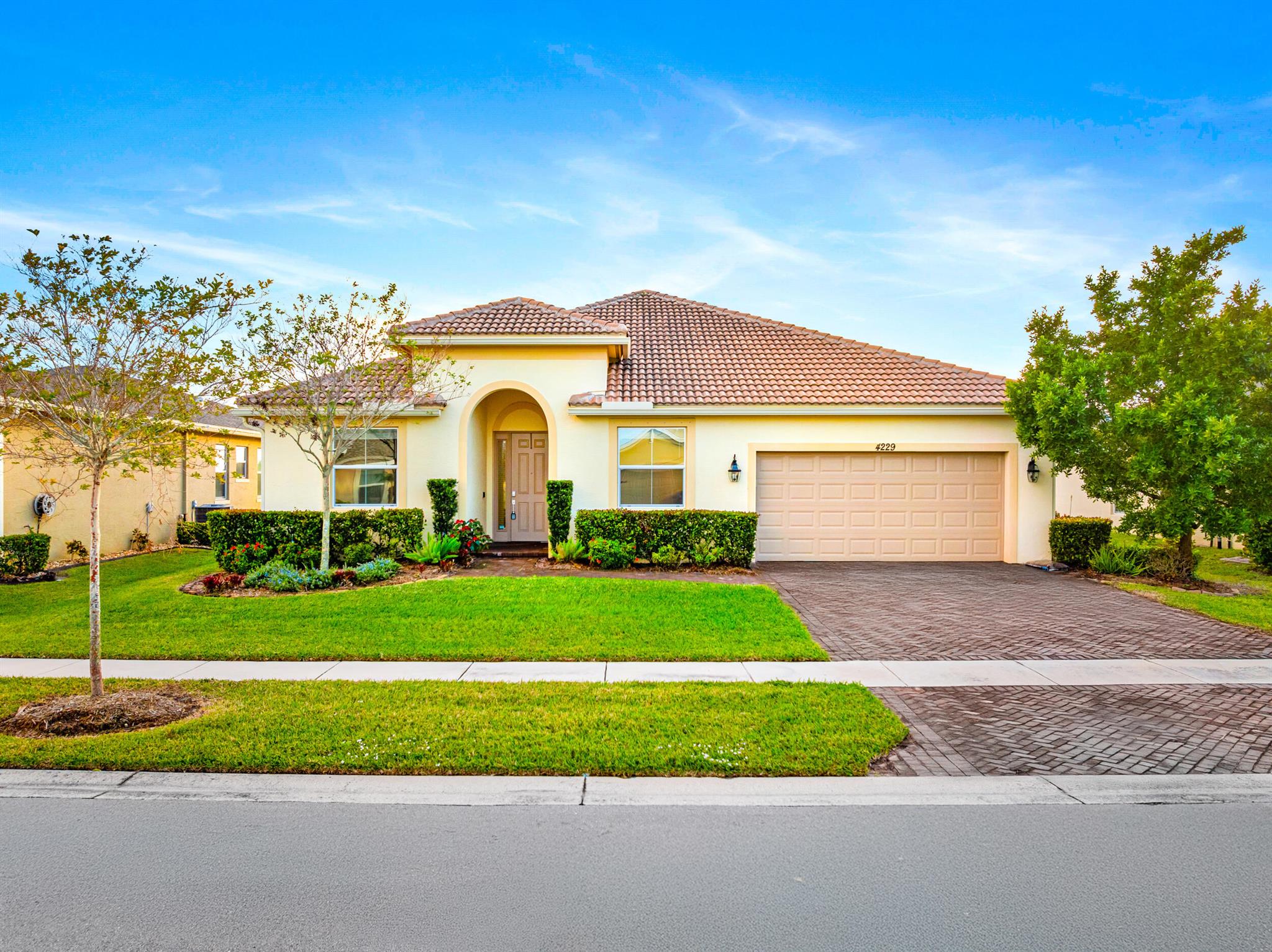 Experience the perfect blend of comfort, style, and pride of ownership in this stunning lakefront home! Impeccably maintained, this home features a durable concrete tile roof, a paver driveway, and a beautifully landscaped, fenced-in backyard with a manicured lawn. Inside, enjoy 4 spacious bedrooms, 3 modern bathrooms, and an open-concept design ideal for living and entertaining. The gourmet kitchen is a chef's dream, equipped with an induction cooktop, GE appliances, granite countertops, and a large island. Unwind on the screened-in patio with breathtaking lake views and sunsets. Situated in the quiet neighborhood of Bent Creek near schools, shopping, and dining, this home offers unmatched comfort and convenience.