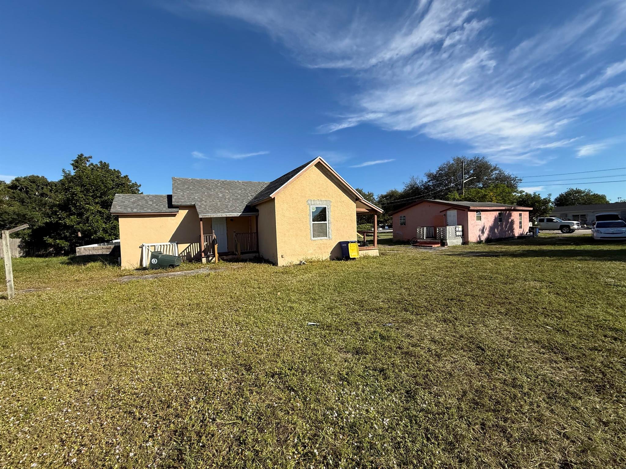 Two houses on one property, 2021 roofs. Both need work. 3/1 & 2/1